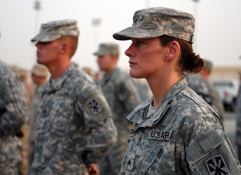 SOUTHWEST ASIA -- U.S. Army Sgt. Karen Curinton, Bravo Battery 5-52nd detachment, stands among fellow Soldiers and Airmen in a formation at the Patriot Day ceremony here to commemorate the fallen responders from the 2001 terrorist attacks. (U.S. Air Force photo/Tech. Sgt. Denise Johnson)(released)