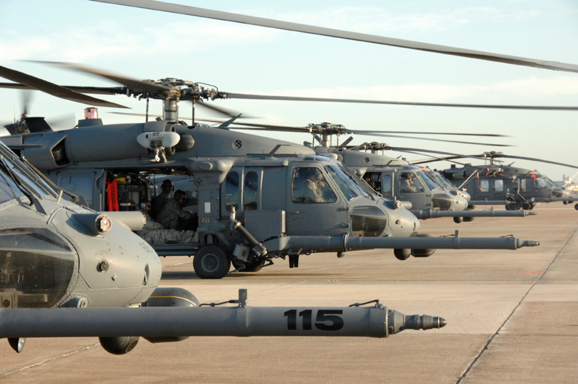 A line of HH-60G Pave Hawks from the 943rd Rescue Group, Davis-Monthan Air Force Base, Ariz., 176th Wing, Kulis Air National Guard Base, Alaska, and 129th Rescue Wing, Moffett Federal Airfield, Calif., supporting Joint Task Force 129, sit on the flightline at Ellington Field in Houston on Sept. 3. The aircraft were relocated to Kelly Field in San Antonio on Sept. 11 in preparation for Hurricane Ike hitting the Texas and Louisiana Gulf Coast. (U.S. Air Force photo/Technical Sgt. Ray Aquino)