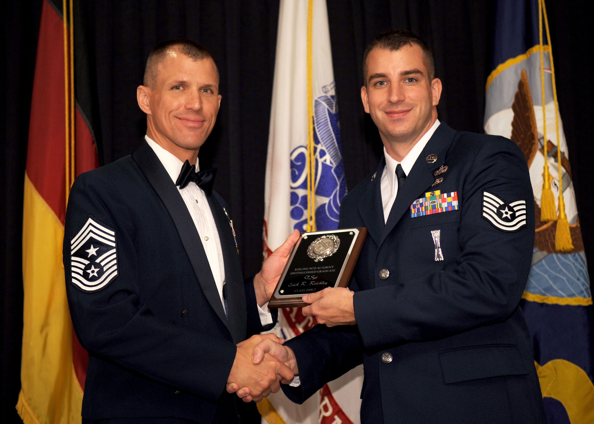 RAMSTEIN AIR BASE, Germany -- Tech. Sgt. Erich Reichley, 52nd Operations Support Squadron, receives the Distinguished Graduate Award at the Non-Commissioned Officer Academy Graduation Sept. 11, 2008. Sergeant Reichley was a member of class 2008-7 flight 09. (U.S. Air Force photo by Senior Airman Levi Riendeau)