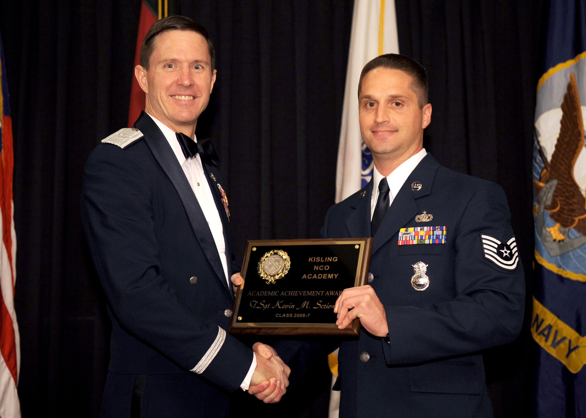 RAMSTEIN AIR BASE, Germany -- Tech. Sgt. Kevin Scrivner, 52nd Security Forces Squadron, receives the Academic Achievement Award at the Non-Commissioned Officer Academy Graduation Sept. 11, 2008. Sergeant Scrivner also earned the Distinguished Graduate Award. (U.S. Air Force photo by Senior Airman Levi Riendeau)
