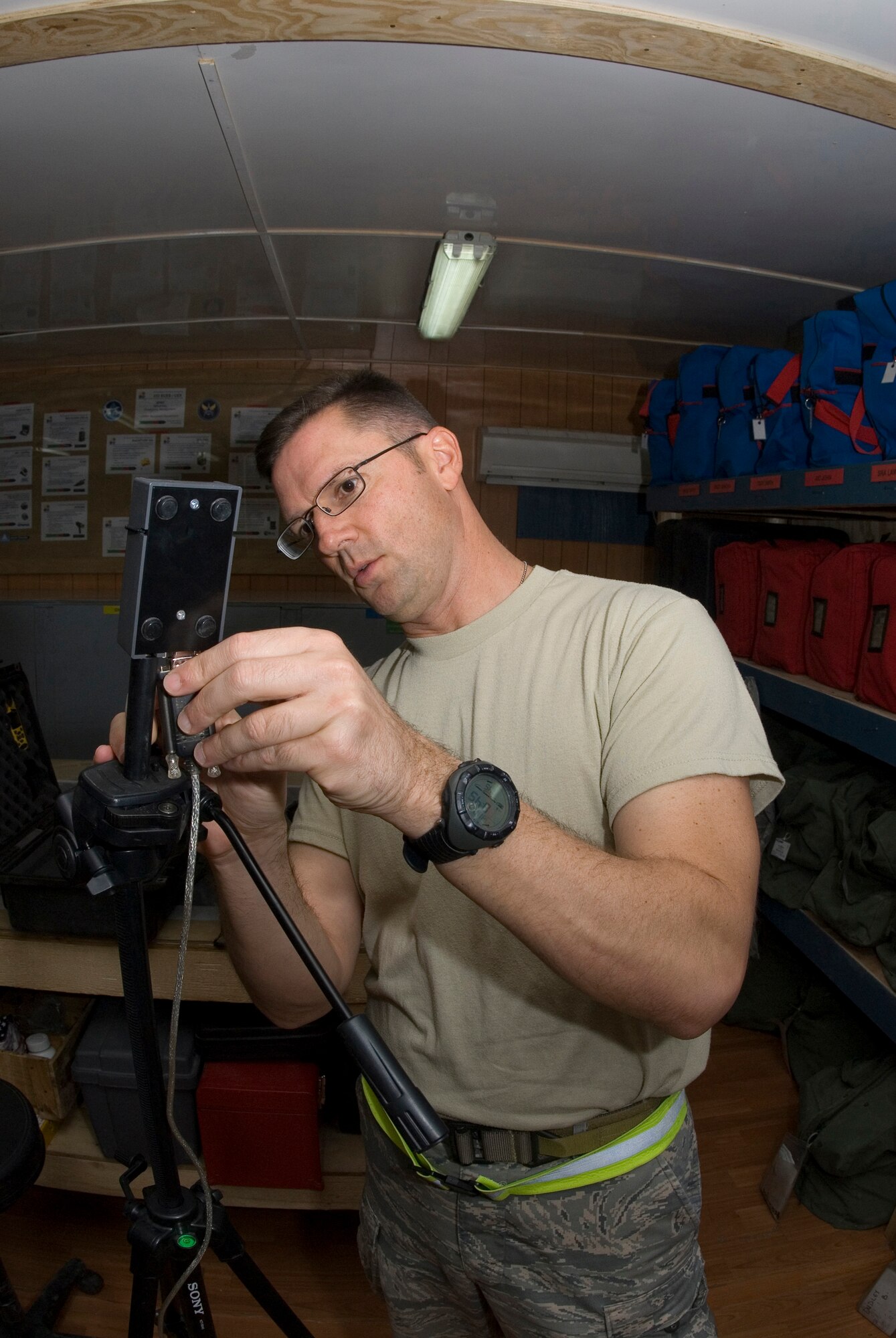 JOINT BASE BALAD, Iraq -- Tech. Sgt. James Smith, 332nd Expeditionary Civil Engineer Squadron readiness and emergency management flight, demonstrates setting up a weather collection device used to get valuable information for the emergency response teams when out in a contaminated environment. Possible threats include chemical, biological, radiological, nuclear and environmental. Smith?s hometown is Merritt Island, Fla., and he is deployed from Langley Air Force Base, Va. (U.S. Air Force photo/Tech Sgt. Erik Gudmundson)