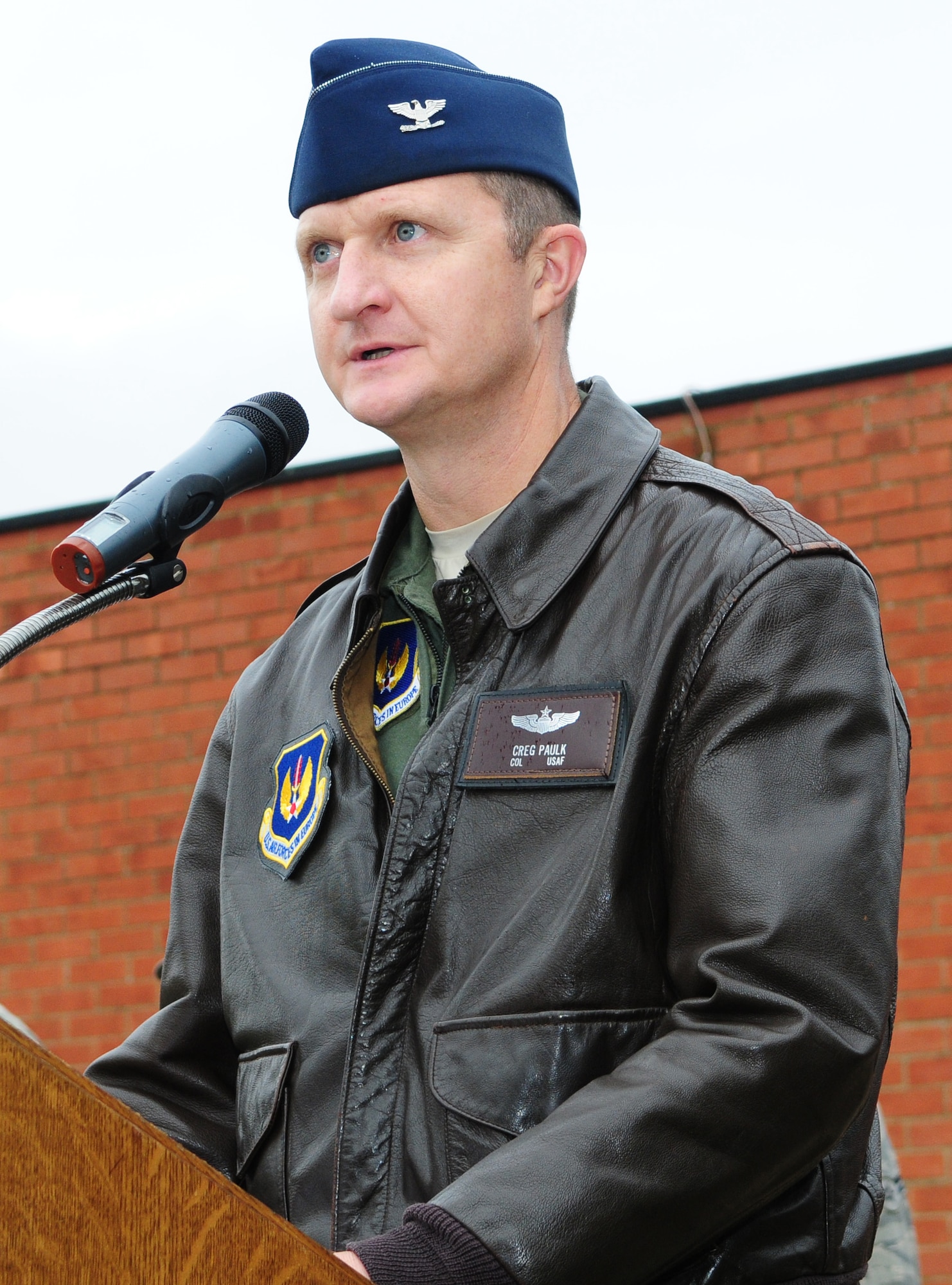 Col. Creg Paulk, 100th Operations Group commander, recites the final part of the Airman's Creed during the Sept. 11 memorial service near the Bob Hope Community Center at RAF Mildenhall, England, Sept. 11. (U.S. Air Force photo by Karen Abeyasekere)