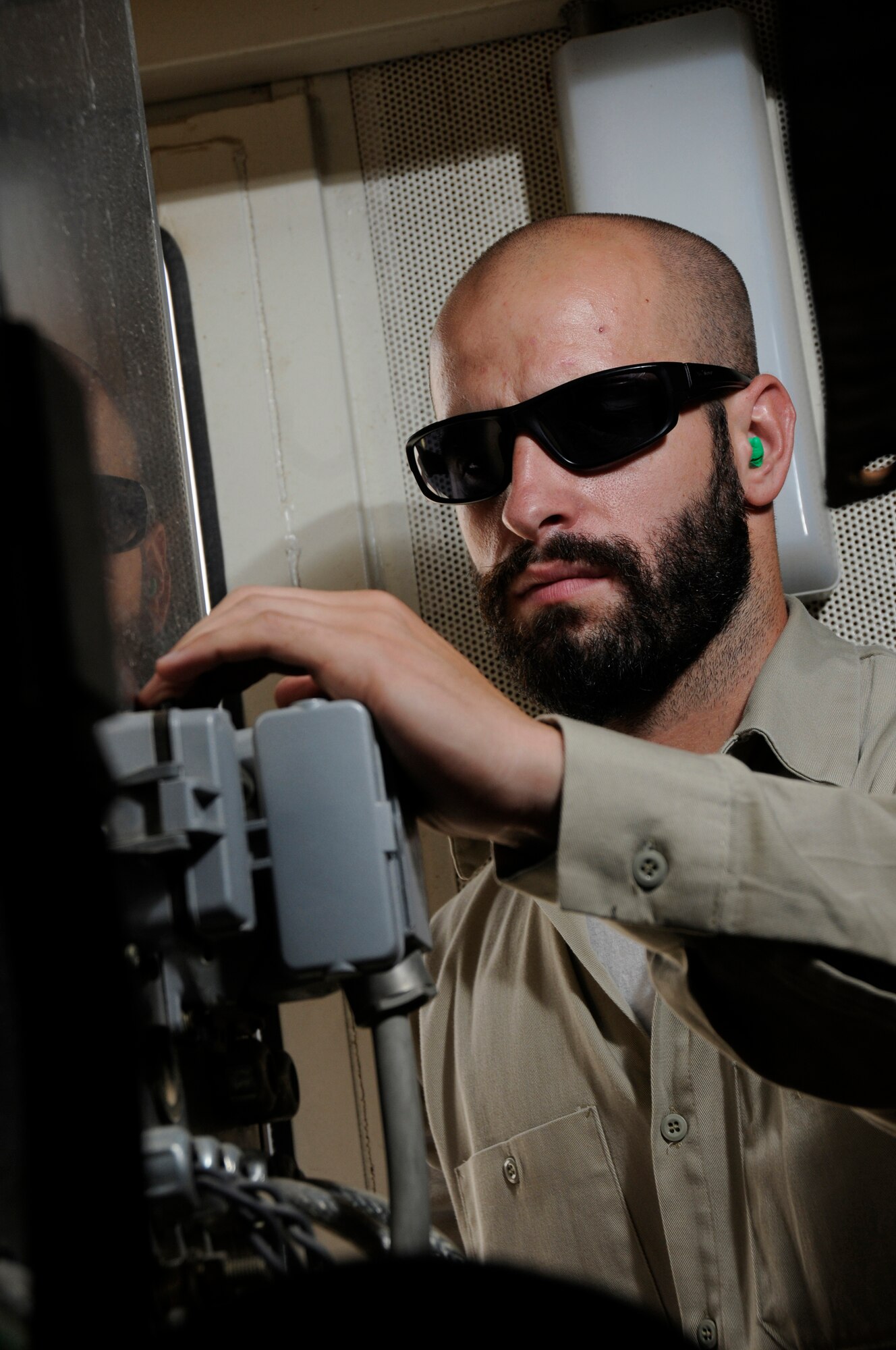Mr. Daniel Dan, generator technician working for Readiness Management Support, performs a preventive maintenance inspection on a generator Sept. 11, 2008, at an undisclosed air base in Southwest Asia. Mr. Dan works in one of the four power plants containing 26 generators which produce power for all the facilities here. Mr. Dan, a native of Huntington Beach, Calif., is supporting Operations Iraqi Freedom, Enduring Freedom and Joint Task Force-Horn of Africa. (U.S. Air Force photo by Staff Sgt. Darnell T. Cannady/Released)