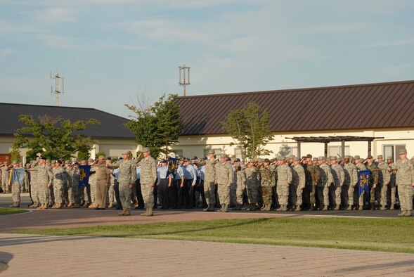 MISAWA AIR BASE, Japan -- Members of the 373rd Intelligence Group render salutes during a 9/11 Retreat Ceremony Sept. 11, 2008.  Groups and squadrons take turns performing retreat ceremonies for various observances throughout the year.  (U.S. Air Force photo by Senior Airman Laura R. McFarlane) 