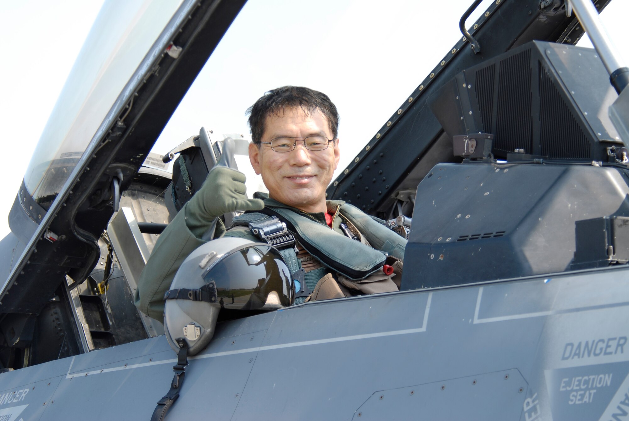 KUNSAN AIR BASE, Republic of Korea--Republic of Korea Air Force Lt. Gen. Cho Won Kun, Air Force Operations Center commander, "pushes it up" after an orientation flight here Sept. 10. (U.S. Air Force photo/Staff Sgt. Jason Colbert)