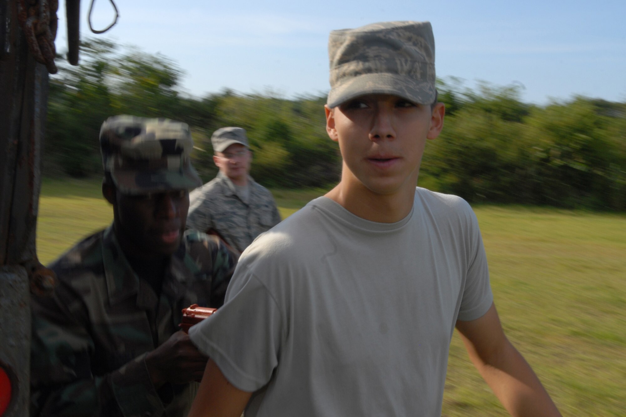 MISAWA AIR BASE, Japan -- Airman 1st Class Troy Teal, 610th Air Control Flight, is captured by Airman 1st Class Michael Bogle, 35th Logistics Readiness Squadron, during the Diesel Weasel Exercise Sept. 11, 2008. During the five-day exercise, many scenarios were played out, thus keeping the training fresh for the participants. (U.S. Air Force photo by Airman 1st Class Jamal D. Sutter) 