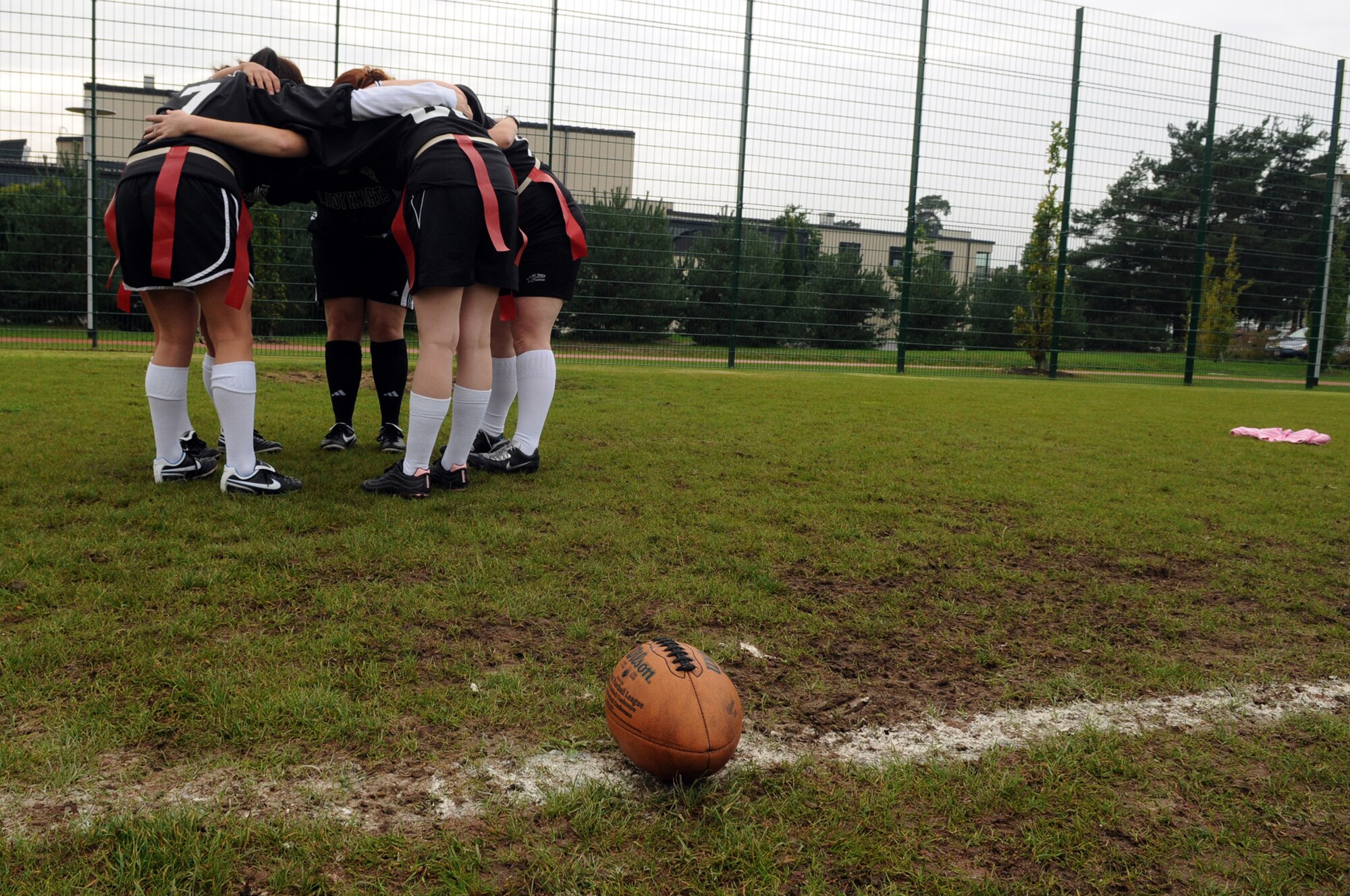 Members of the Lady Knights flag football team have a huddle during practice, Ramstein Air Base, Germany, Sep. 10, 2008. (U.S. Air Force photo by Senior Airman Kelly LeGuillon)(Released)