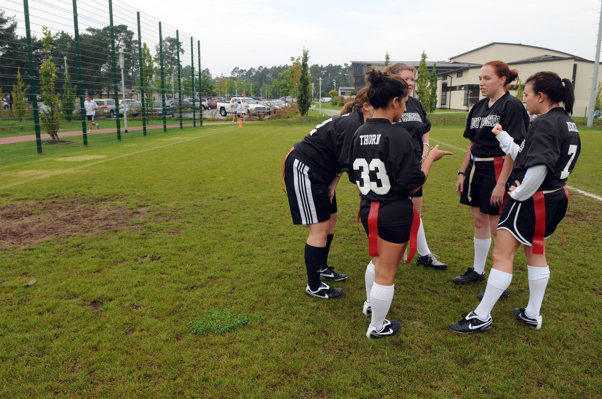 Members of the Lady Knights flag football team have a huddle during practice, Ramstein Air Base, Germany, Sep. 10, 2008. (U.S. Air Force photo by Senior Airman Kelly LeGuillon)(Released)