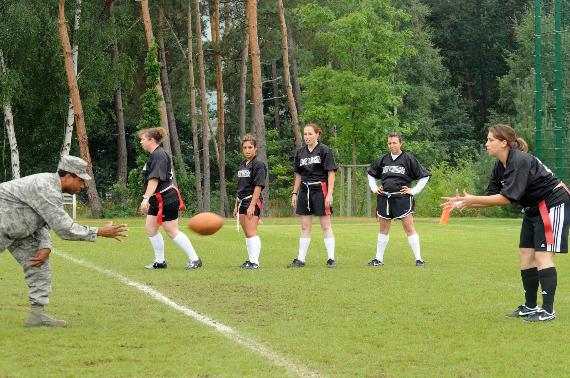 Members of the Lady Knights flag football team practice passing drills, Ramstein Air Base, Germany, Sep. 10, 2008. (U.S. Air Force photo by Senior Airman Kelly LeGuillon)(Released)