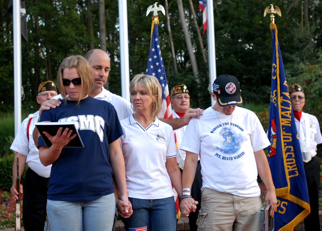 The McVickers, Molly (left), Mark, and Irma, of Alliance, Ohio, share their support with Scott Warner, of Canton. Warner's son, Marine Pvt. Heath D. Warner, was killed while serving in Iraq’s Anbar province, on Nov. 22, 2006. The McVickers’ son, Marine Pfc. Daniel McVicker, was killed in Qaim, Iraq, on Oct. 6, 2005. The families participated in Sebring, Ohio's third annual America Supports You Freedom Walk on Sept. 11, 2008. 