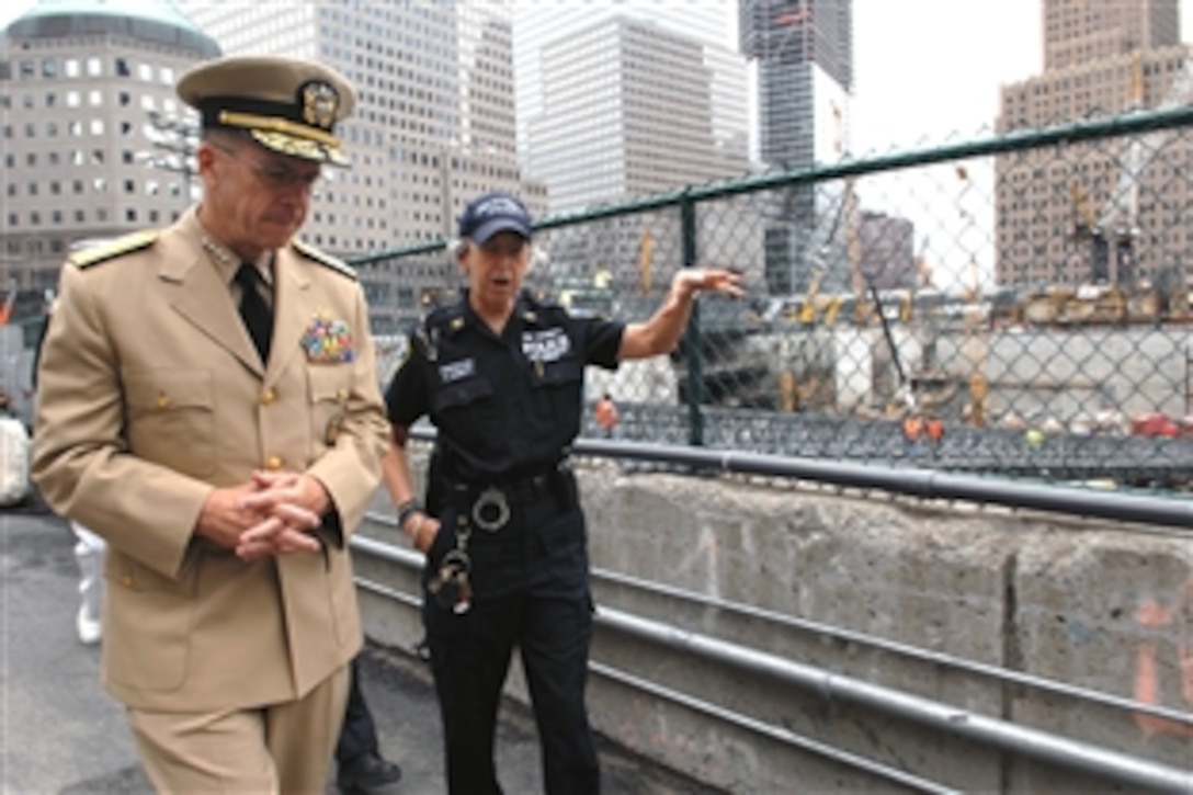 Chairman of the Joint Chiefs of Staff U.S. Navy Adm. Mike Mullen is given an overview of the Ground Zero construction by Port Authority Police Inspector Susan Durrett in New York City, Sept. 12, 2008. Mullen toured the 9/11 crash site the day after giving a speech during the Pentagon Memorial Dedication in Washington, D.C., for 9/11 victims. 