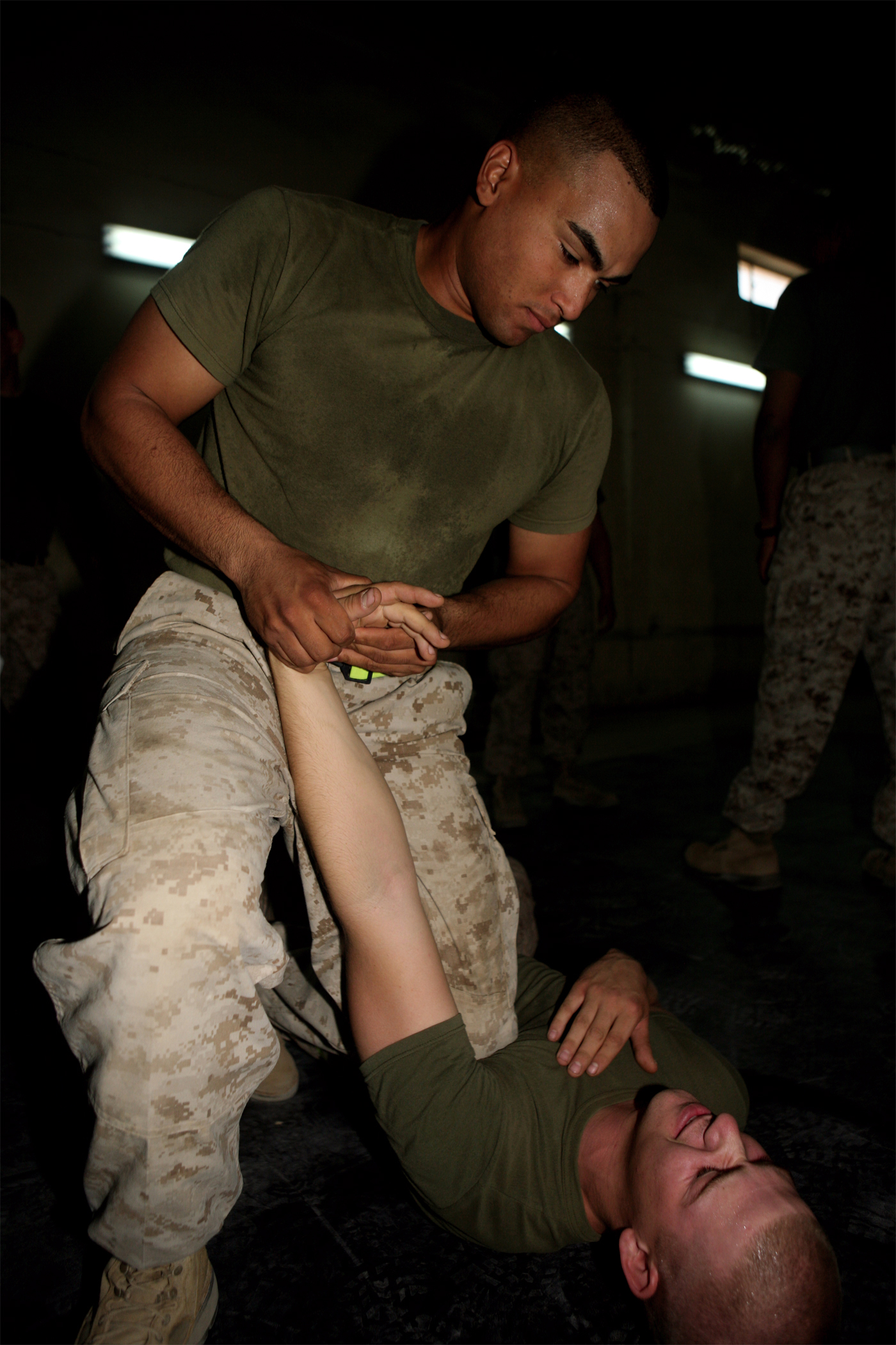 CAMP HABBANIYAH, Iraq (September 13, 2008) – Sgt. Alberto Andino, the battalion maintenance management chief with Headquarters and Service Company, Task Force 1st Battalion, 2nd Marine Regiment, Regimental Combat Team 1, executes a wrist lock on Pvt. Chad Reep, the battalion maintenance management clerk Sept. 12. Marines are participating in an accelerated and focused course designed to increase their aptitude for MCMAP by two belts in a matter of weeks. (Official U.S. Marine Corps photo by Lance Cpl. Scott Schmidt)