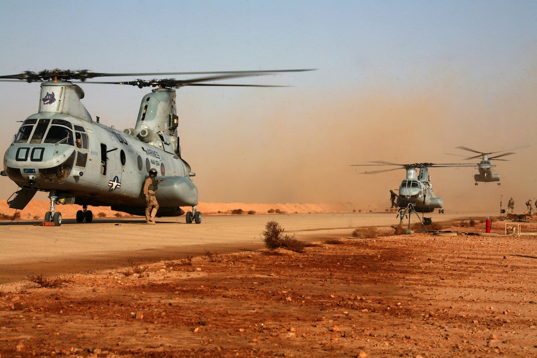 Three CH-46E Sea Knights land here Sept. 12 to refuel during a reconnaissance mission in the area Sept. 12. Marine Wing Support Squadron 374 turned an abandoned Iraqi air base into a forward arming and refueling point in just more than two days.