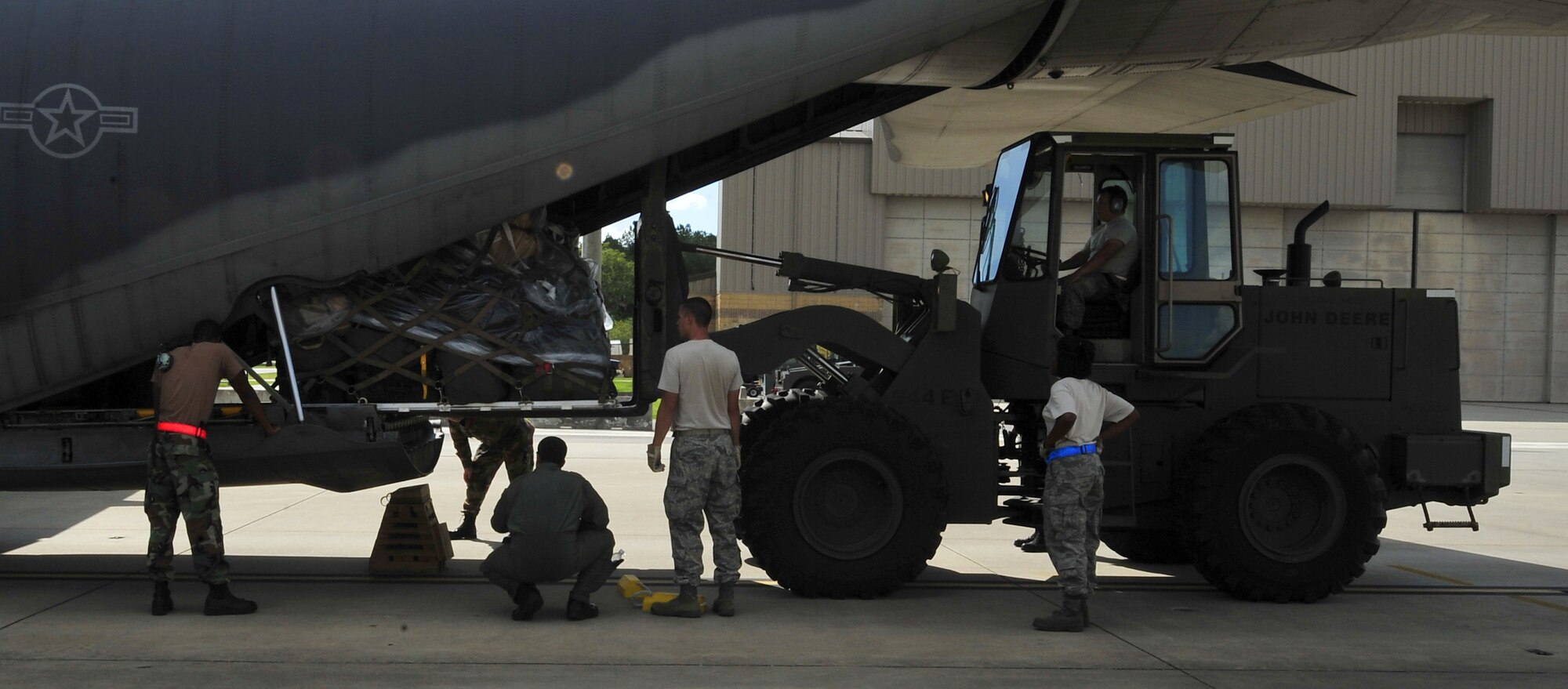 MOODY AIR FORCE BASE, Ga. – 23rd Logistics Readiness Squadron Airmen load a baggage pallet into a HC-130E Hercules here Sept.13. The 23rd Wing Airmen boarded on this aircraft are the first responders from Moody who are deploying in relief of Hurricane Ike. (U.S. Air Force photo by Senior Airman Elizabeth Rissmiller)