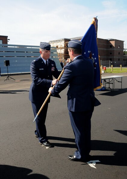 Maj. Gen. Michael Akey passing the flag to Col. Robert Brooks during the 14th command change in the 104th Fighter WIngs' 60 year history.