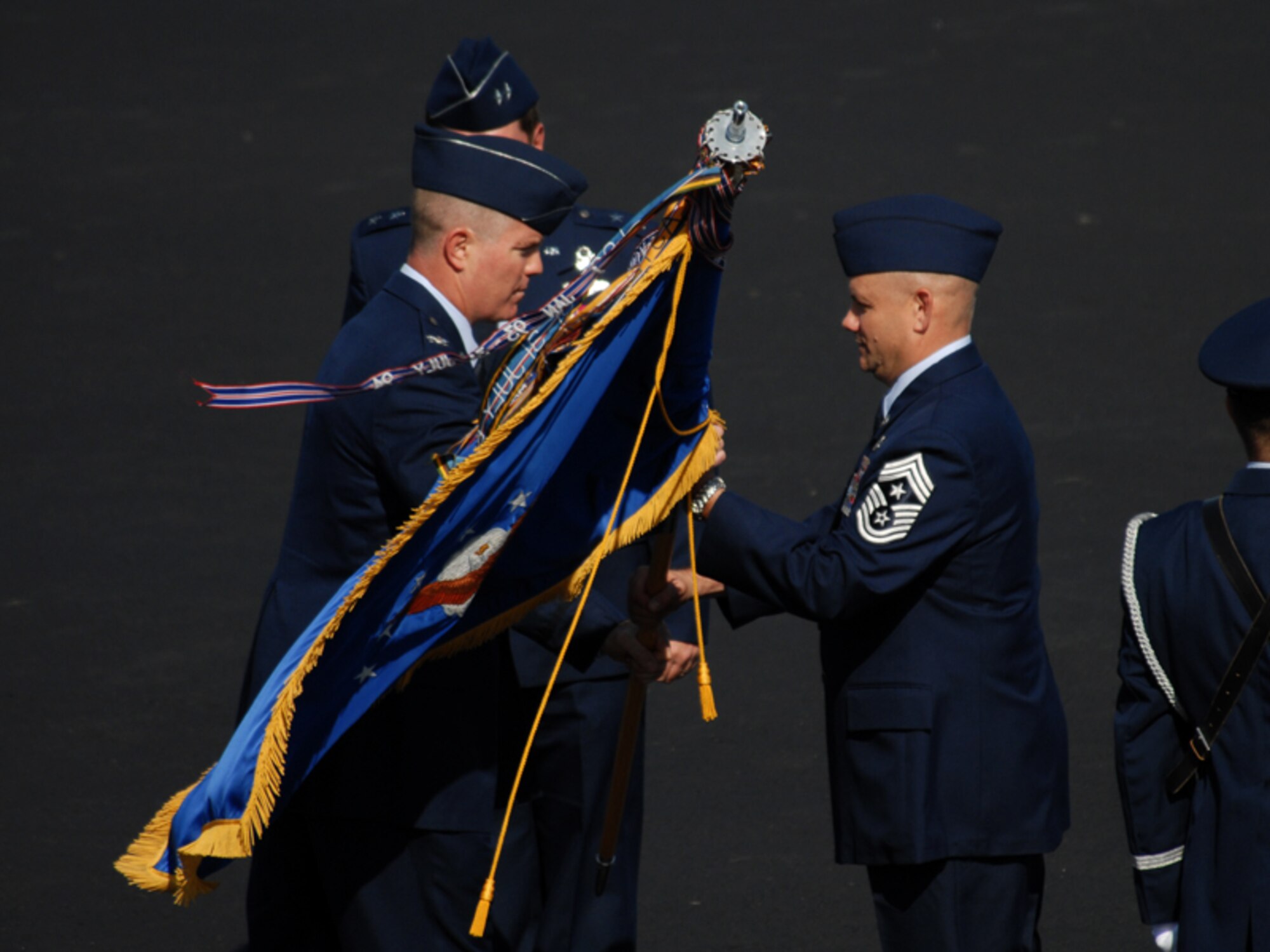 Symbolic passing of the flag.