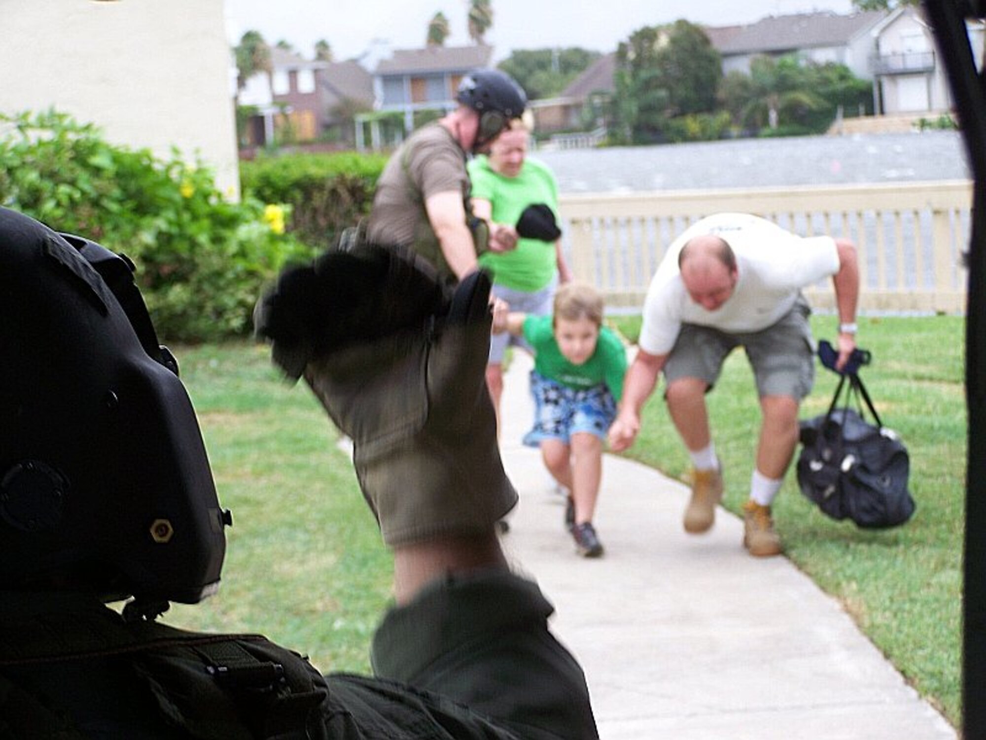 Joint Task Force 129 crew, Jolly 92, rescues a family of four in Galveston, Texas, Sept. 12. (U.S. Air Force photo by Master Sgt. Wally Bacio)