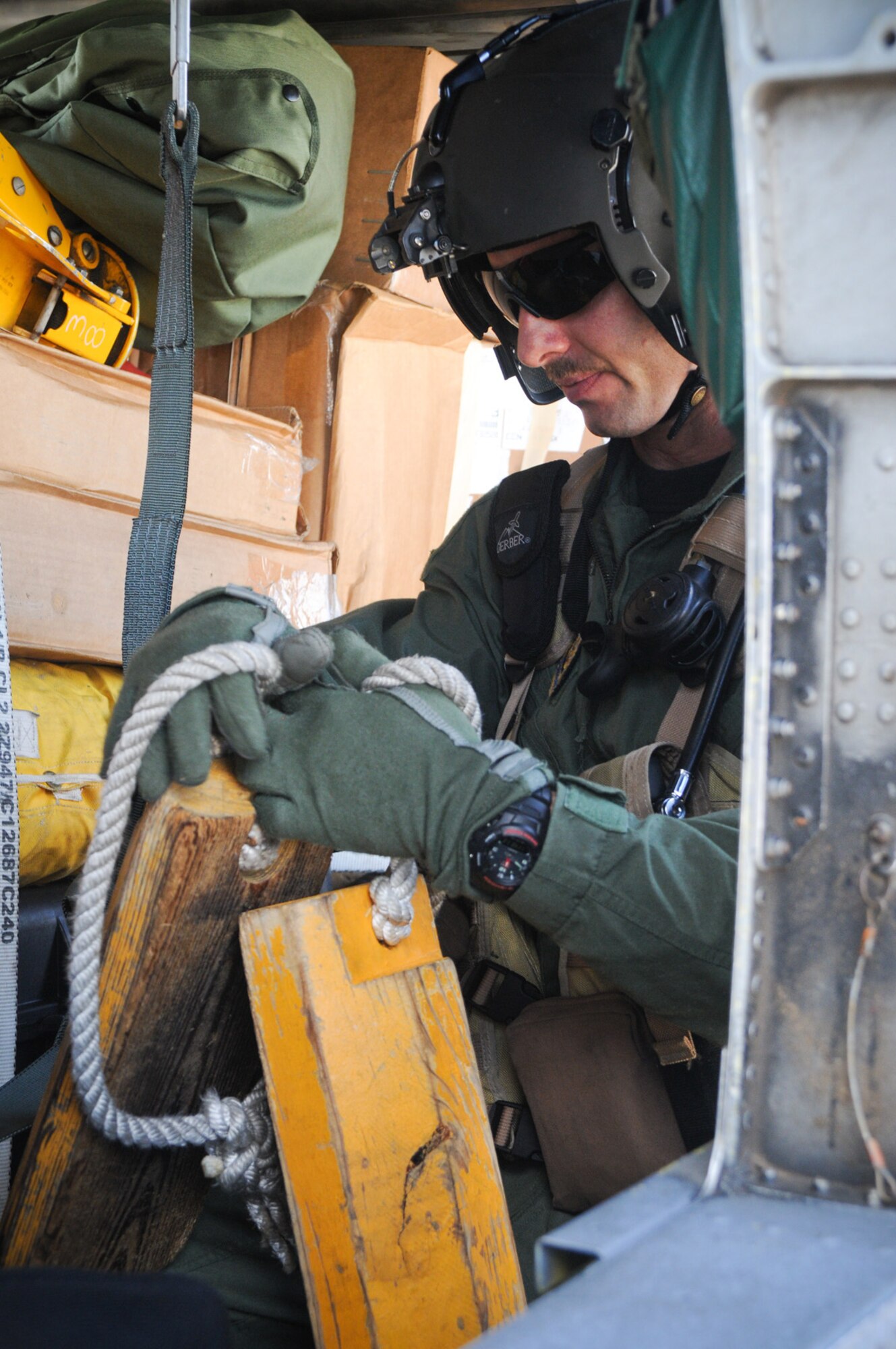 PATRICK AIR FORCE BASE, Fla. --  An Air Force Reserve helicopter crew member with the 920th Rescue Wing readies his HH-60G Pave Hawk helicopter for service in the Gulf region.  The unit's mission following Hurricane Ike's landfall is to serve affected states with qualified and immediate medical care, while bringing the ability to conduct air refueling, air lift, air drops of supplies and the ability to hoist people in need out of flooding water. (U.S. Air Force photo / Capt. Cathleen Snow)