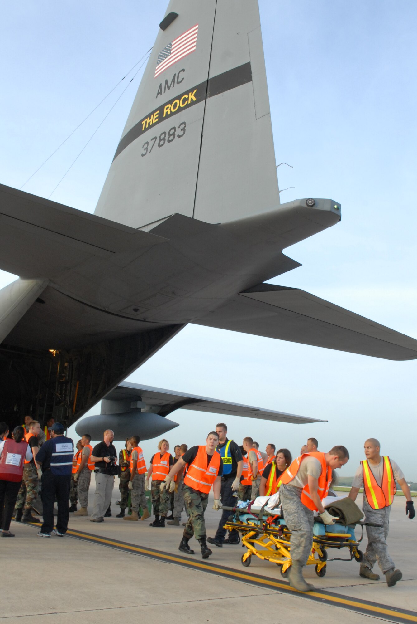 LACKLAND AIR FORCE BASE, Texas -- U.S. Air Force Airmen from the 37th and 59th Air Wing unload hospital patients that were evacuated from Beaumont, Texas, September 12, 2008. These patients were transported by a combined effort from the Little Rock Air Force Base C-130 aircraft and crews and the 908th Aero medical Evacuation Squadron, Scott Air Force Base, IL in preparation for Hurricane Ike's landfall in southern Texas.  (U.S. Air Force photo by Staff Sgt. Chris Willis) (RELEASED)