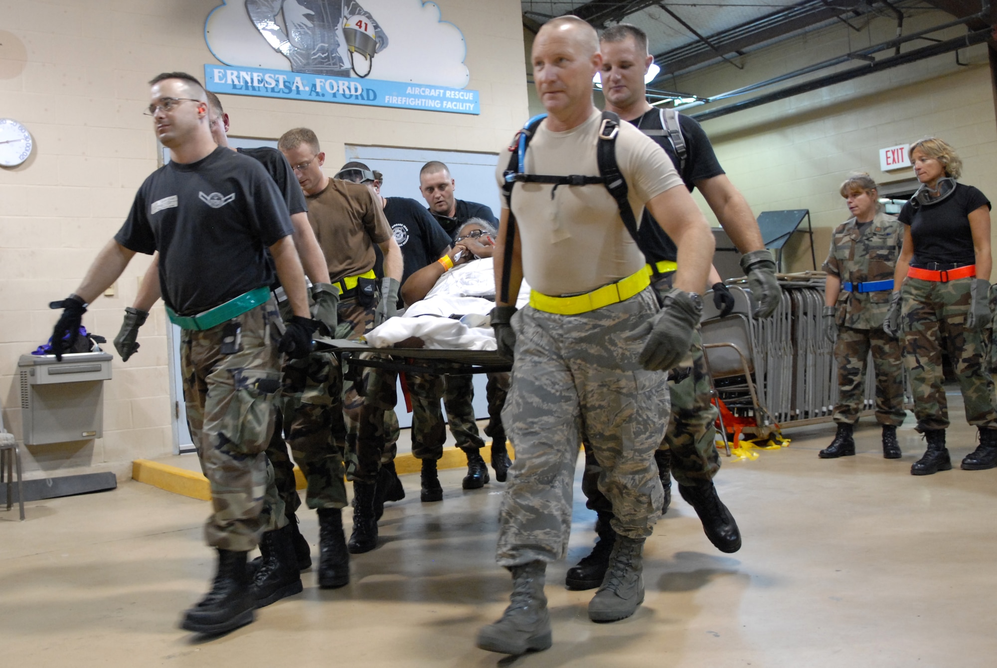 BEAUMONT AIRPORT, Texas -- U.S. Air Force Airmen made up of active duty, Guard, and Reserve from multiple Air Force Bases load hospital patients onto a C-130 aircraft, September 12, 2008. Little Rock Air Force Base C-130s were deployed to perform aero medical and transportation missions in preparation for Hurricane Ike's landfall in southern Texas.  (U.S. Air Force photo by Staff Sgt. Chris Willis) (RELEASED)