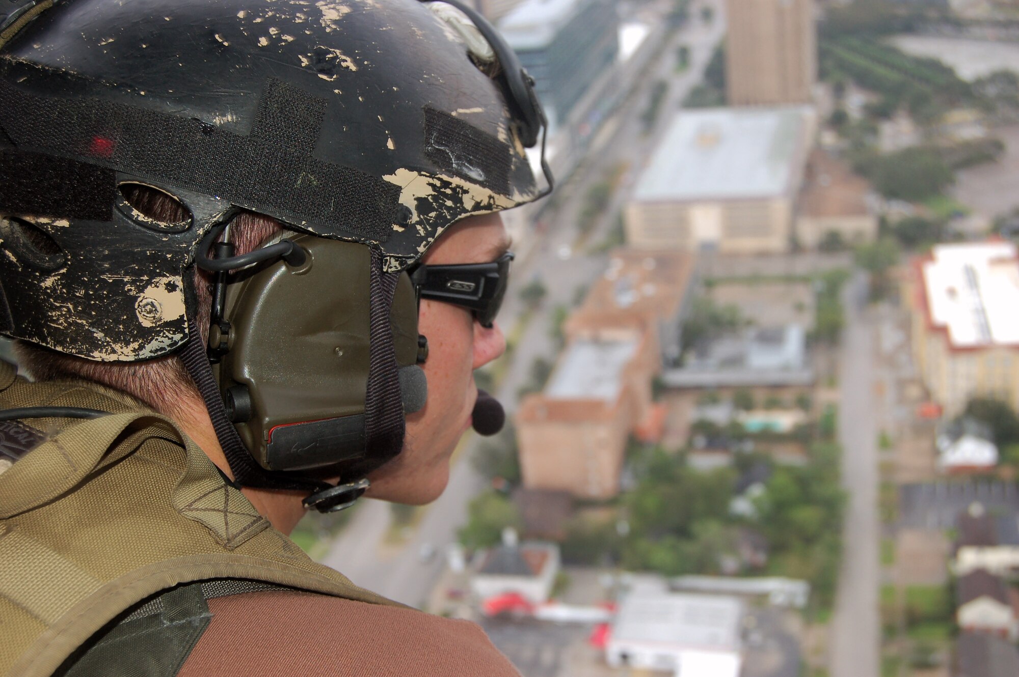 Staff Sgt. Rick Caldwell looks from an HH-60G Pave Hawk at the damage caused by Hurricane Ike Sept. 13 around Houston. Airmen from across the Air Force are deployed to the 331st Air Expeditionary Group at Randolph Air Force Base, Texas, to assist with rescue missions. Sergeant Caldwell is assigned to the 48th Rescue Squadron from Davis-Monthan Air Force Base, Ariz. (U.S. Air Force photo/Staff Sgt. Corey Parrish) 
