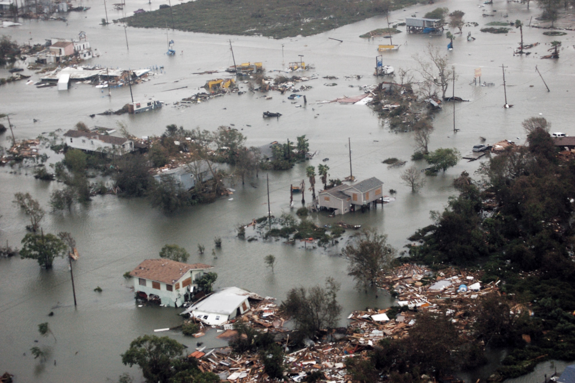 Airmen aboard an HH-60G Pave Hawk survey the damage caused by Hurricane Ike Sept. 13 around Galveston, Texas. Airmen from across the Air Force are deployed to the 331st Air Expeditionary Group at Randolph Air Force Base, Texas, to assist with rescue operations. (U.S. Air Force photo/Staff Sgt. Corey Parrish)
