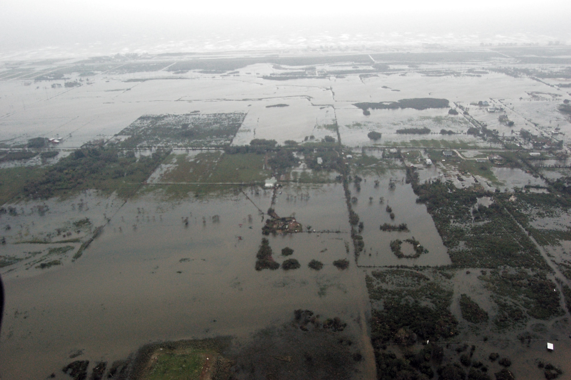 Airmen aboard an HH-60G Pave Hawk survey the damage caused by Hurricane Ike Sept. 13 around Galveston, Texas. Airmen from across the Air Force are deployed to the 331st Air Expeditionary Group at Randolph Air Force Base, Texas, to assist with rescue operations. (U.S. Air Force photo/Staff Sgt. Corey Parrish)

