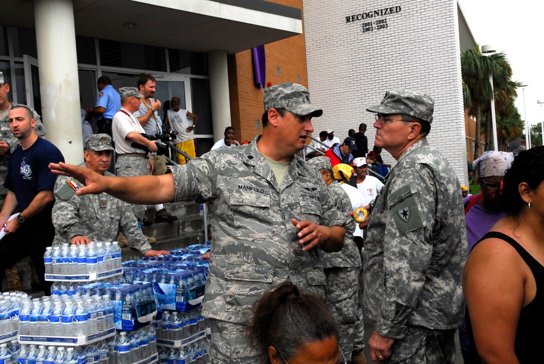LtCol Craig Manifold directs evacuation flow at Ball High School in Gavleston after hurricane Ike slammed into the Texas Coast.  Texas Military Forces personnel are part of the state and federal multi-agency Task Force Ike assisting in recovery af the category two hurricane. (Photo by Senior Master Sgt. Miguel Arellano)
