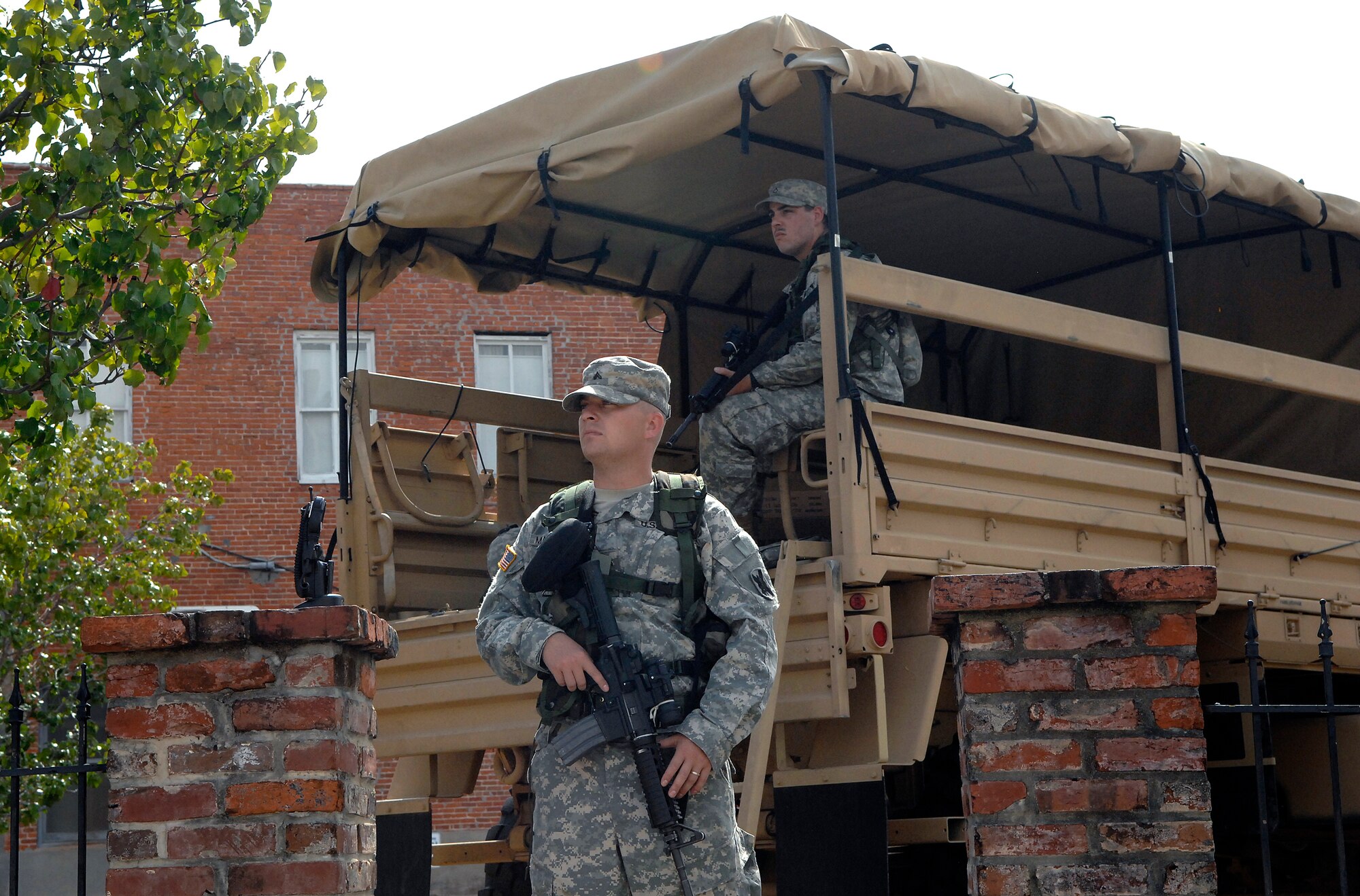 Corporal Jody Mahaffey (front) and Private First Class Kevin Farr (back) of the Army National Guard protect high risk looting targets such as pawn shops, gun shops and pharmacies in downtown Lake Charles, La., in anticipation of  of Hurricane Ike Sept. 12. Cpl. Mahaffey and PFC. Farr and assigned to the Louisiana Army National Guard, Bravo Company, 3rd Battalion, 156 Infantry. 
(U.S. Air Force Photo/Staff Sgt. Bennie J. Davis III)