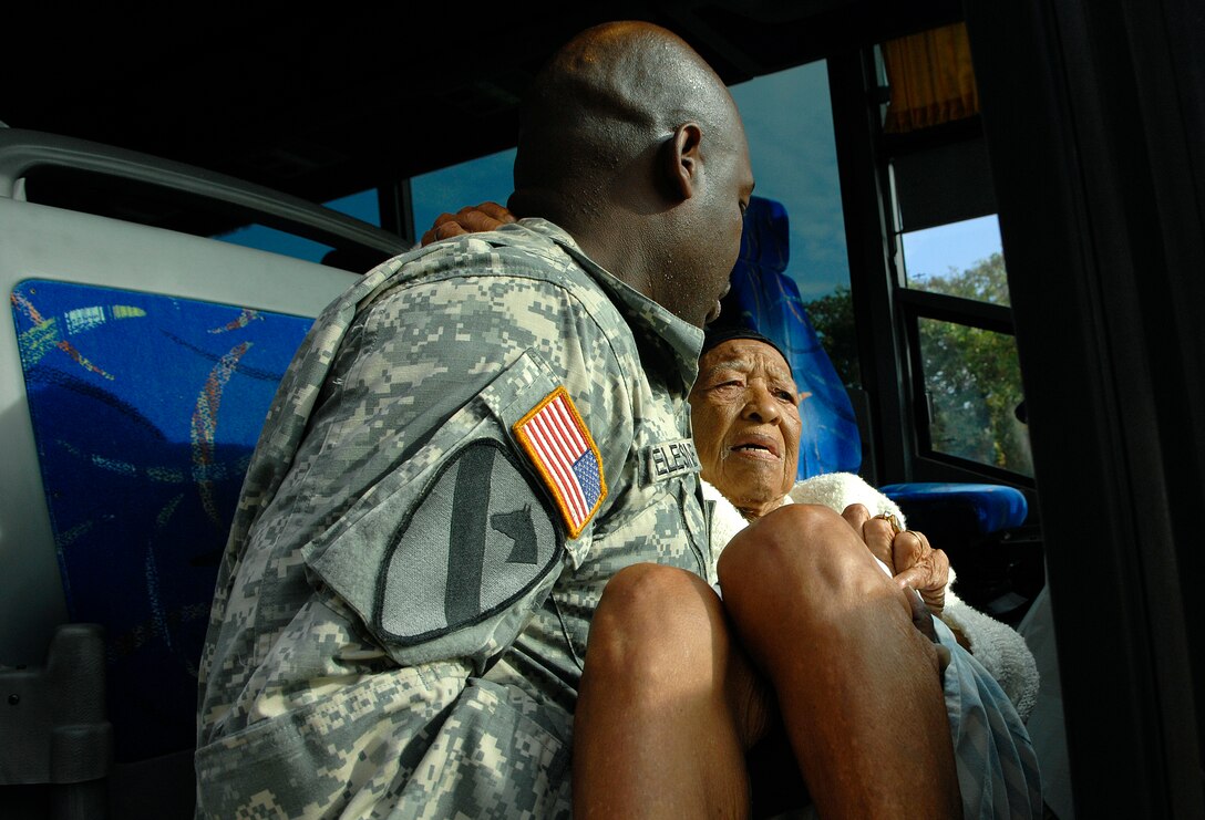 Army Staff Sgt. Gateson Celestine carries Mrs. Annie Bowman, 85, of Lake Charles, La., into a bus reserved for special needs evacuees headed to Shreveport, La., in lieu of Hurricane Ike Sept. 12 at the Lake Charles Civic Center. "I don't know where I'm going, but I know the Army will keep me safe," Mrs. Bowman while boarding the bus. Staff Sgt. Celestine is assigned to the Louisiana Army National Guard's 199 Support Battalion Alpha Company.
(U.S. Air Force Photo/Staff Sgt. Bennie J. Davis III)