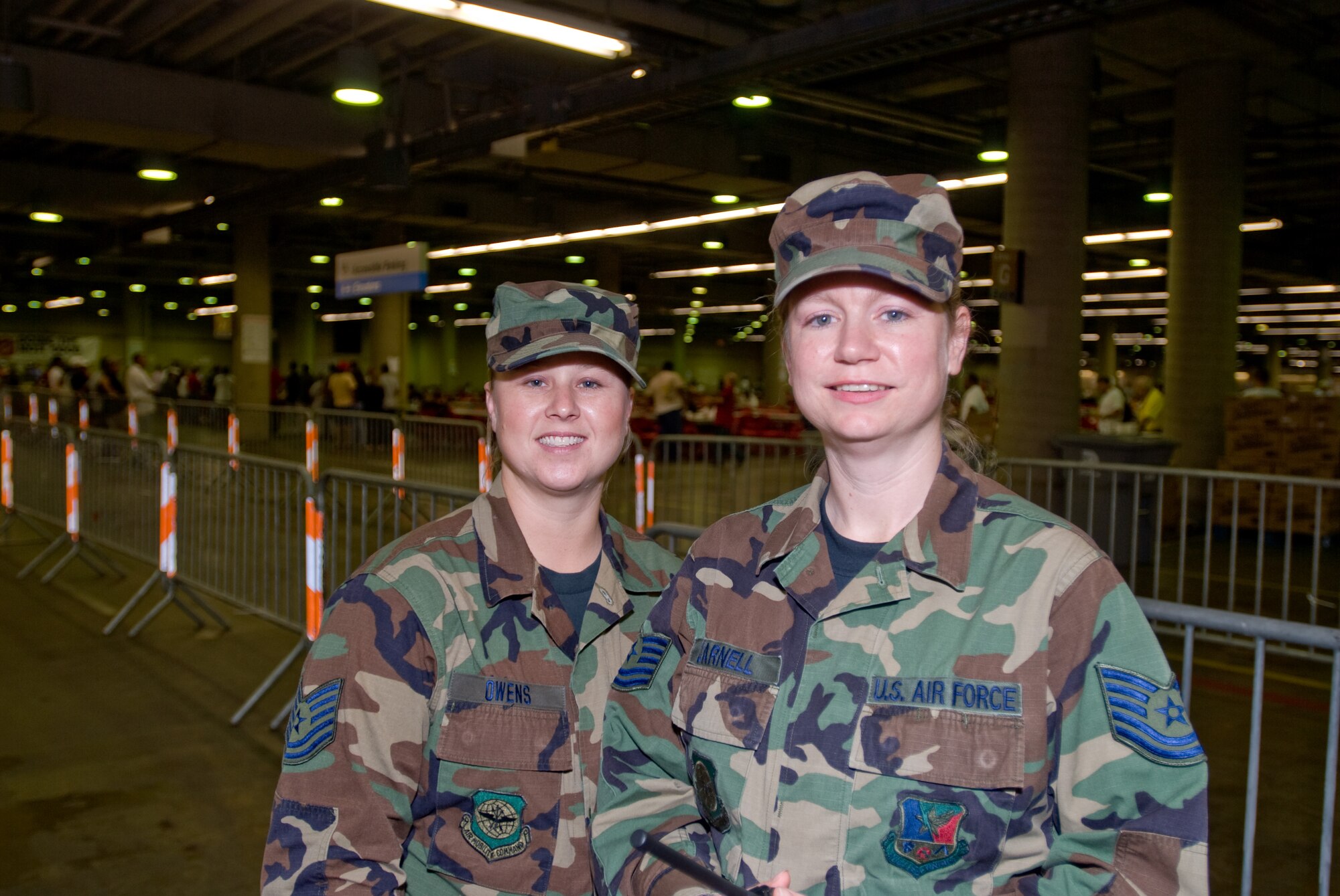 U.S. Air Force Technical Sergeant Erica Darnell and Technical Sergeant Tammy Owens from 136th Airlift Wing, Texas Air National Guard, Fort Worth stand by as shelter management assistants for  hurricane evacuees at the Dallas Convention Center, Dallas TX September 14, 2008.  (Air Force photo By: TSgt Charles Hatton) CLEARED