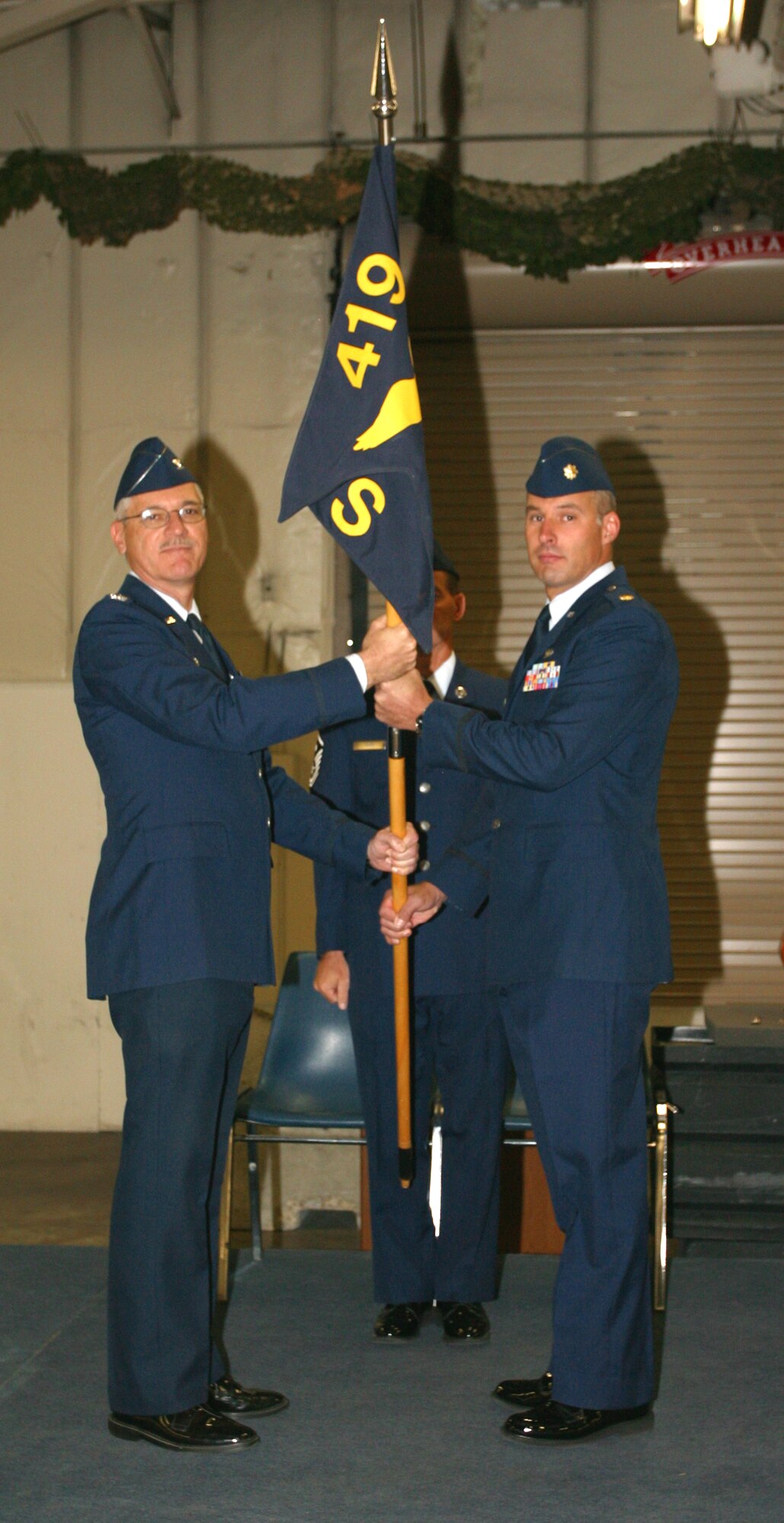 Maj. Keith Mecham assumes command of the 419th Logistics Readiness Squadron from Col. Charles Mood, commander of the 419th Mission Support Group, on Sept. 13. Prior to assuming command of the LRS, Major Mecham was the operations officer for the 67th Aerial Port. (U.S. Air Force Photo/Staff Sgt. Kyle Braiser) 