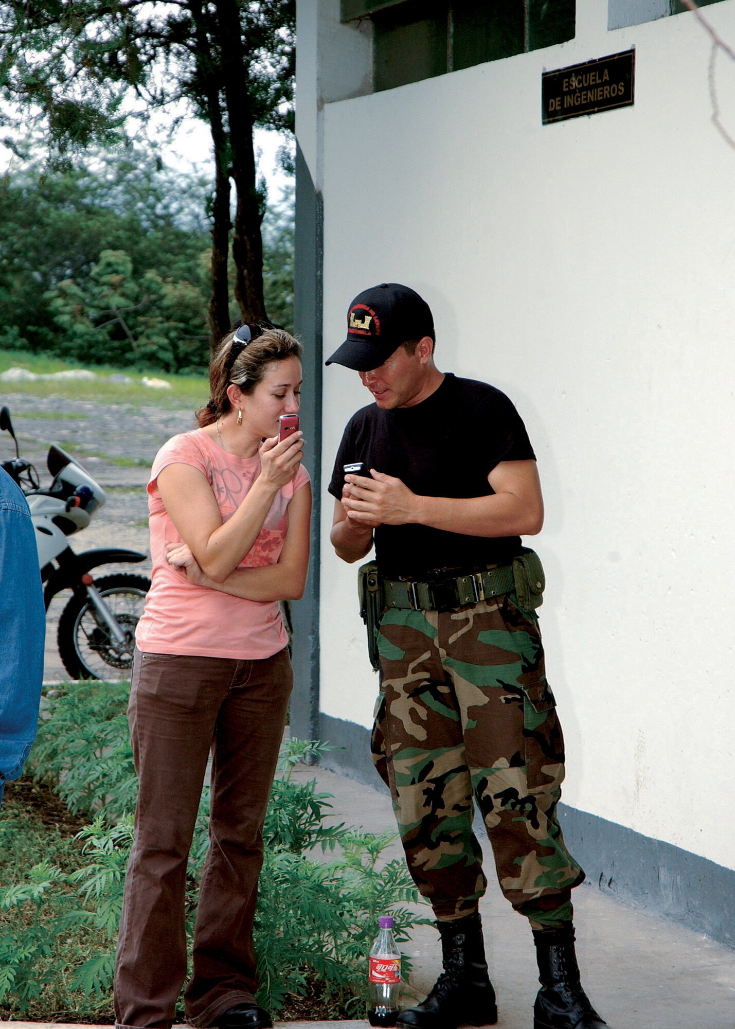 Tech. Sgt. Shirley Morales, in Santa Rosa, Guatemala, for a medical exercise, reminisces with a childhood friend who is now in the Guatemalan Army.  Sergeant Morales, who was born and raised in Santa Rosa, accompanied the 163d Medical Group during a recent medical readiness training exercise to assist with translating for the team.  Sergeant Morales is a force development technician with the 163rd Reconnaissance Wing.  (U.S. Air Force photo)