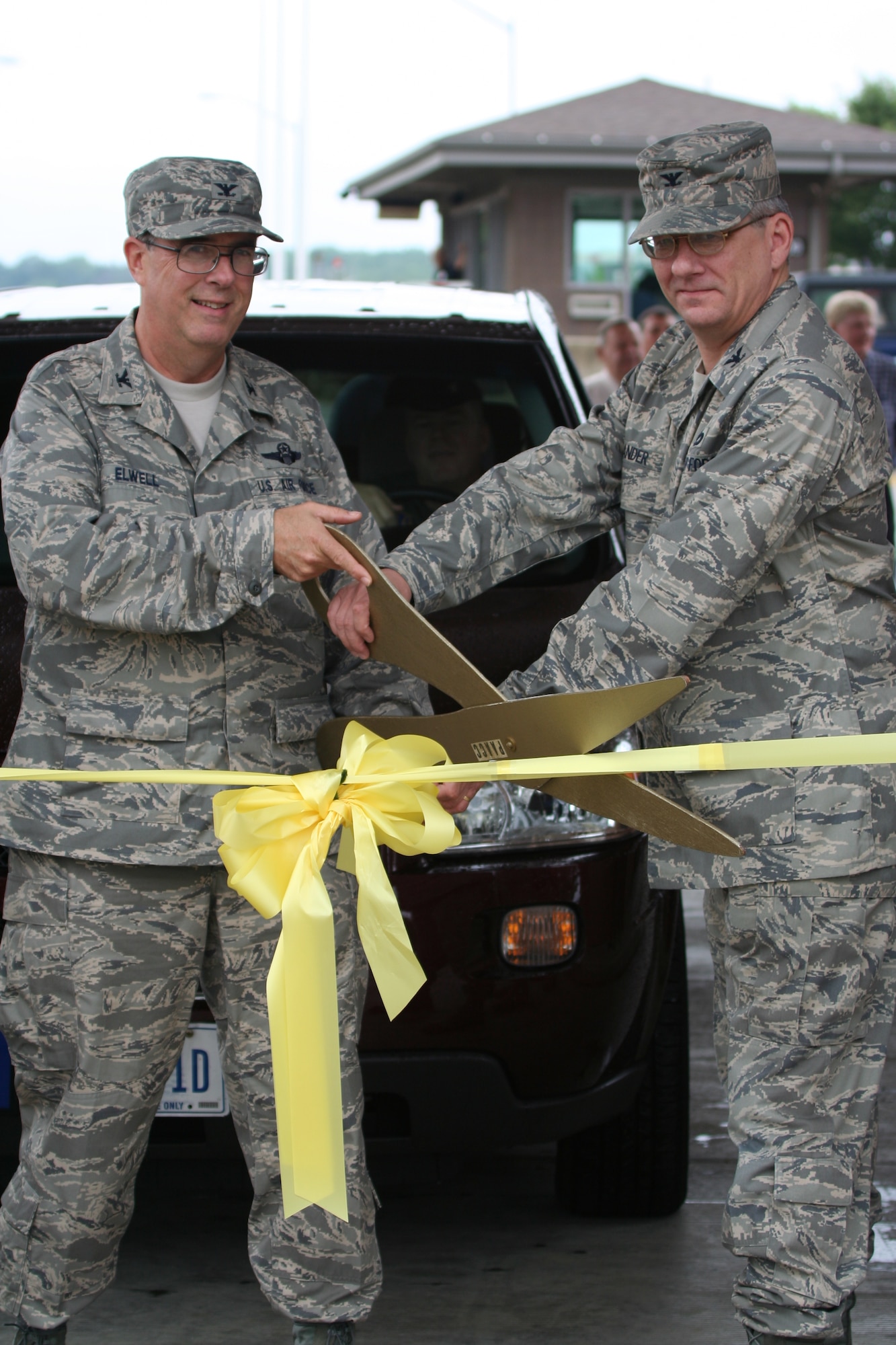 Col. Gordon H. Elwell, Jr., commander of the 911th Airlift Wing, and Col. Steven Zander, deputy director of installation and mission support with the Air Force Reserve Command, cut the ribbon at the opening ceremony of Veterans Gate July 9, 2008. The ceremony marked the completion of the first phase to update the main entrance to the 911th AW. (U.S. Air Force Reserve photo/ Master Sgt. Mark Winklosky)