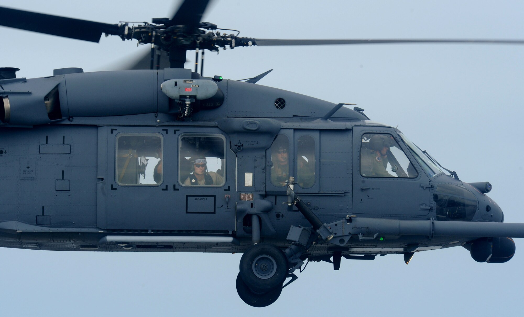 Crewmen watch for stranded people Sept. 13 as an HH-60 Pave Hawk assigned to the 331st Air Expeditionary Group conducts search and rescue operations over Galveston, Texas, Sept. 13. in the aftermath of Hurricane Ike.  (U.S. Air Force photo/Staff Sgt. James L. Harper Jr.)
