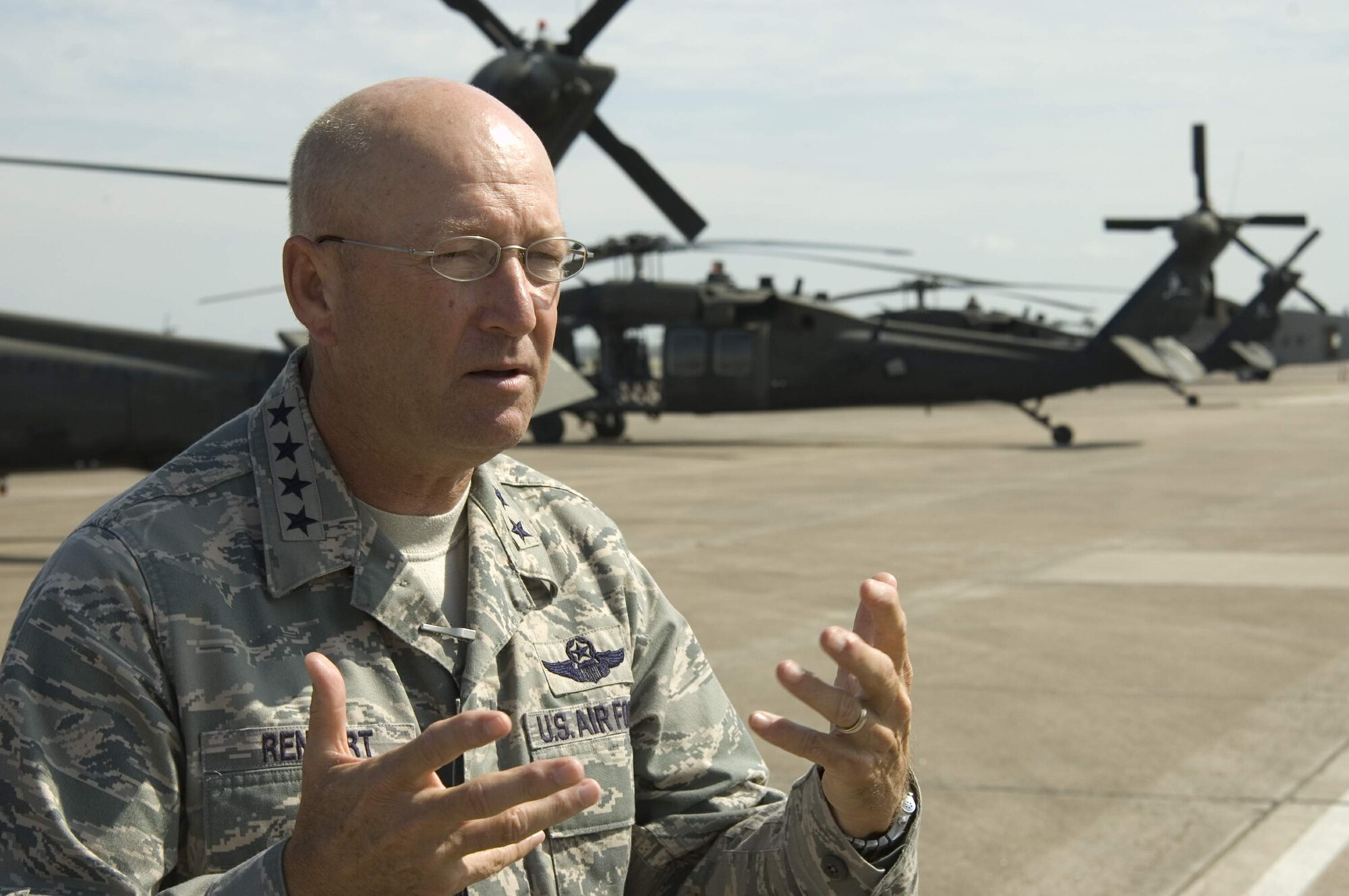 Gen. Victor E. Renuart Jr. describes areas affected by Hurricane Ike after a survey of damaged areas along the Gulf Coast from a UH-60 Pave Hawk Sept. 15 at Ellington Field, Texas. General Renuart is the commander of U.S. Northern Command. (U.S. Air Force photo/Tech. Sgt. Matthew McGovern)
