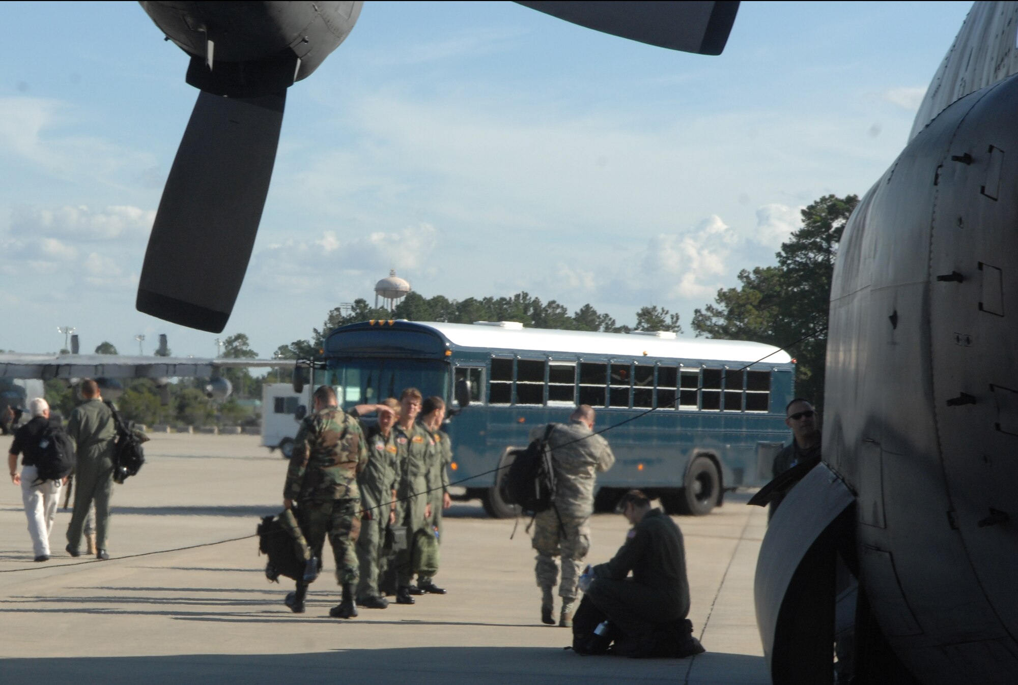 71st Amxs step off C130 head for bus 