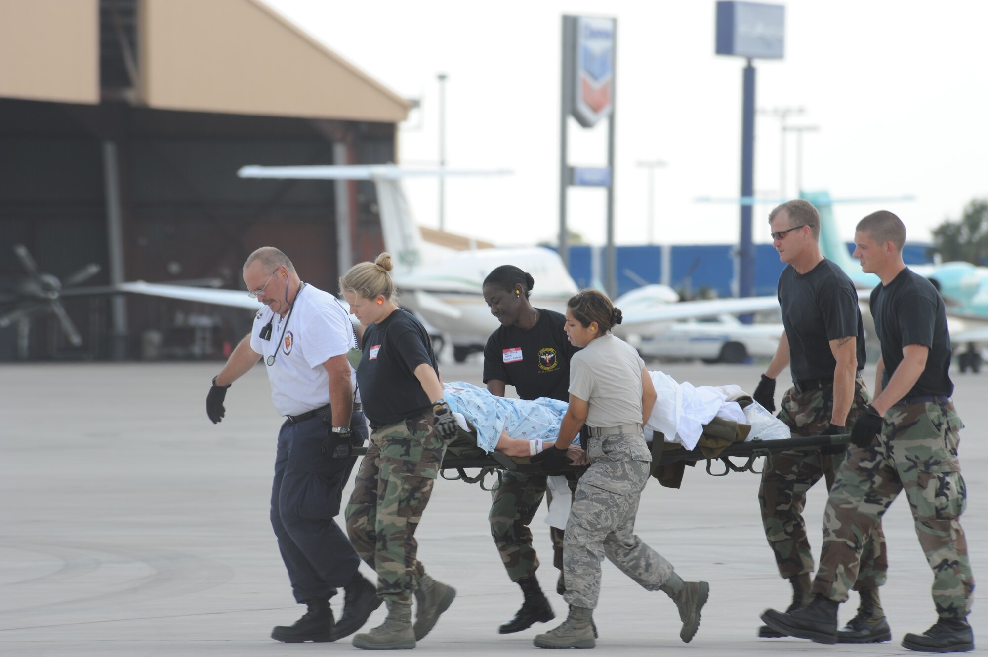 CORPUS CHRISTI, Texas- Medical personnel return patients to the staging facility to wait to be picked up and returned to the hospital here, Sept. 11. The medical personnel were prepared to handle minimal care and intensive care patients. The Air Force and other military forces not only respond in support of war efforts abroad but also to threats on the home front including natural disasters. (U.S. Air Force photo/ Senior Airman Courtney Richardson) 