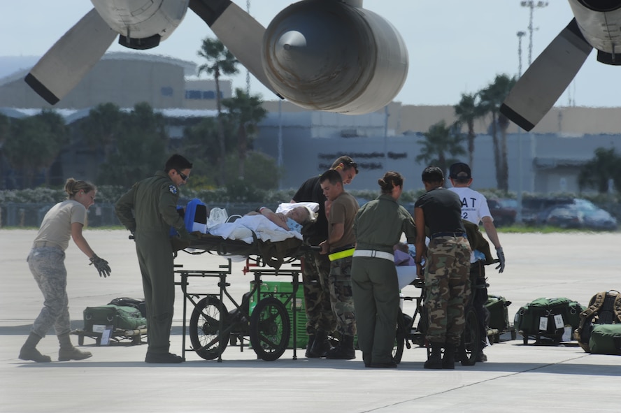 CORPUS CHRISTI, Texas- Medical personnel assist with the safe return of patients to the staging facility here, Sept. 11. The staging facility was set up to hold 200 federal, state and civilian personnel along with 600 patients. The Air Force and other military forces not only respond in support of war efforts abroad but also to threats on the home front including natural disasters. (U.S. Air Force photo/ Senior Airman Courtney Richardson) 