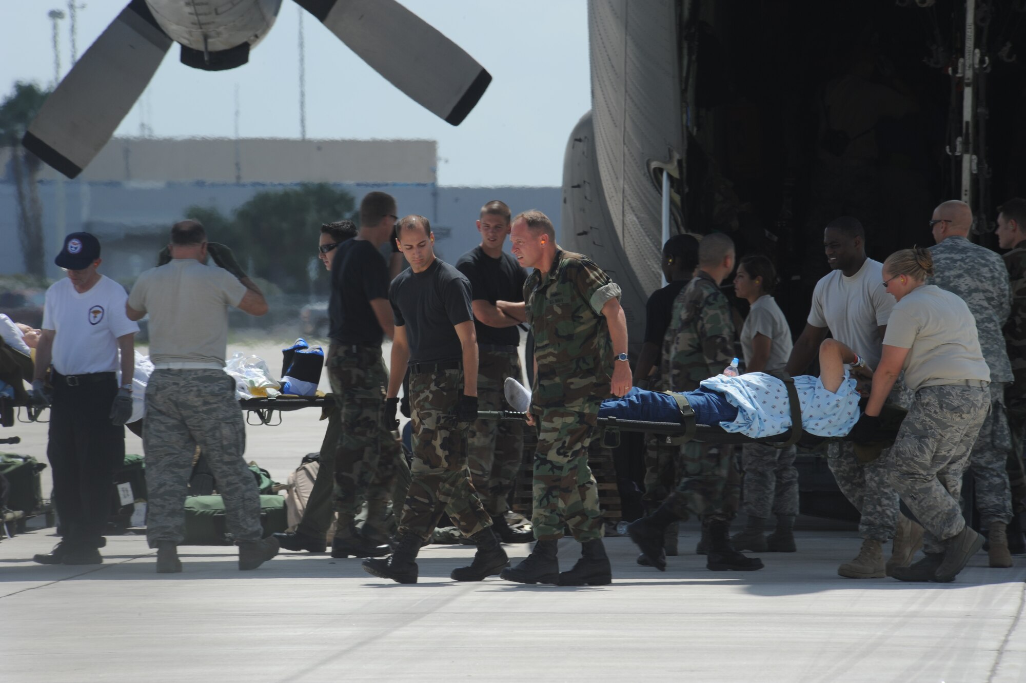 CORPUS CHRISTI, Texas- Patients were carried one by one off of a C-130 and returned to the staging facility after the evacuation of Corpus Christi was cancelled, Sept. 11. After being notified of immediate evacuation the staging facility was set up and ready for use within two hours. The Air Force and other military forces not only respond in support of war efforts abroad but also to threats on the home front including natural disasters. (U.S. Air Force photo/ Senior Airman Courtney Richardson)