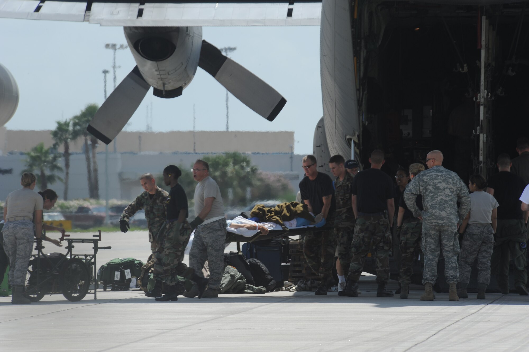 CORPUS CHRISTI, Texas- Patients are removed from a C-130 after being told they were returning to the hospital, here,  due to the hurricane changing its direction, Sept. 11. After waiting for two days to be transported to safer locations the patients were notified they weren't in any immediate danger. The Air Force and other military forces not only respond in support of war efforts abroad but also to threats on the home front including natural disasters. (U.S. Air Force photo/ Senior Airman Courtney Richardson) 