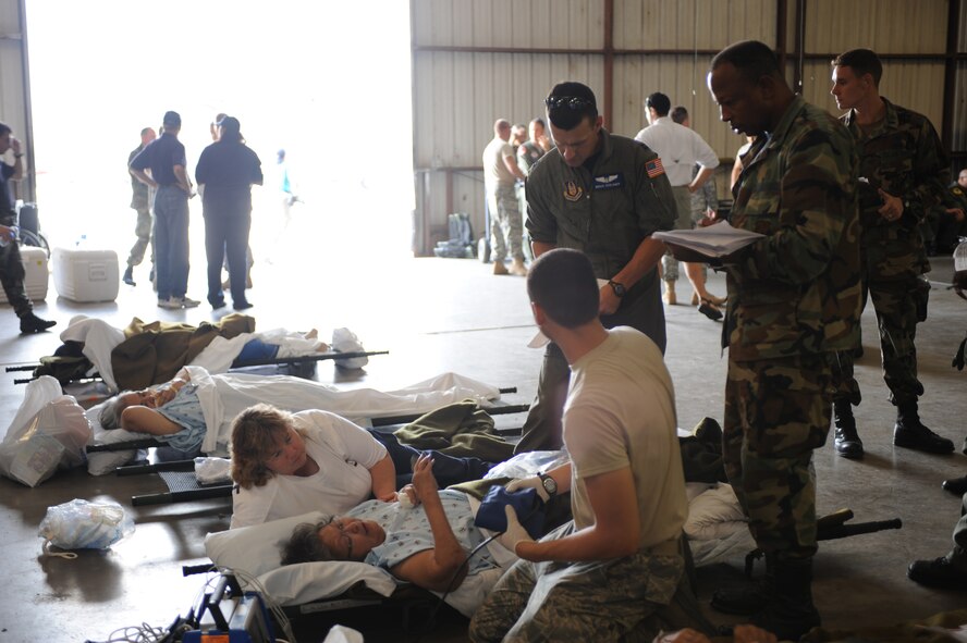 CORPUS CHRISTI, Texas- Medical personnel check the blood pressure of a patient in the staging facility here, while they wait for transportation to safer location due to Hurricane Ike, Sept. 11. The staging facility is capable of handling up to 600 patients along with 200 medical personnel. The Air Force and other military forces not only respond in support of war efforts abroad but also to threats on the home front including natural disasters. (U.S. Air Force photo/ Senior Airman Courtney Richardson) 