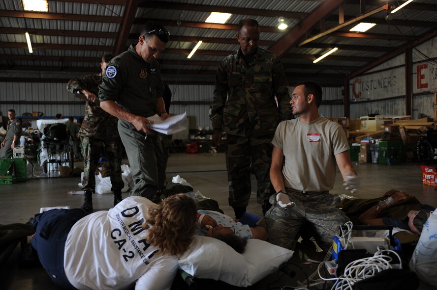 CORPUS CHRISTI, Texas- Medical personnel take vital signs from a patient in the staging facility here, during the evacuation of south Texas in preparation of Hurricane Ike, Sept. 11. There were 200 federal, state and civilian assets early Wednesday morning to coordinate, manage and transport medical patients from Corpus Christi and the surrounding areas to a safer location for definitive care in preparation of Hurricane Ike. The Air Force and other military forces not only respond in support of war efforts abroad but also to threats on the home front including natural disasters. (U.S. Air Force photo/ Senior Airman Courtney Richardson) 