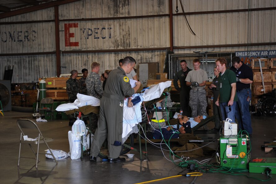 CORPUS CHRISTI, Texas- A military member assist a patient in a hangar here, during the evacuation of south Texas, in preparation of Hurricane Ike, Sept. 11. 80-90 patients are expected to evacuate the Corpus Christi area until Hurricane Ike shifts north. The Air Force and other military forces not only respond in support of war efforts abroad but also to threats on the home front including natural disasters. (U.S. Air Force photo/ Senior Airman Courtney Richardson)