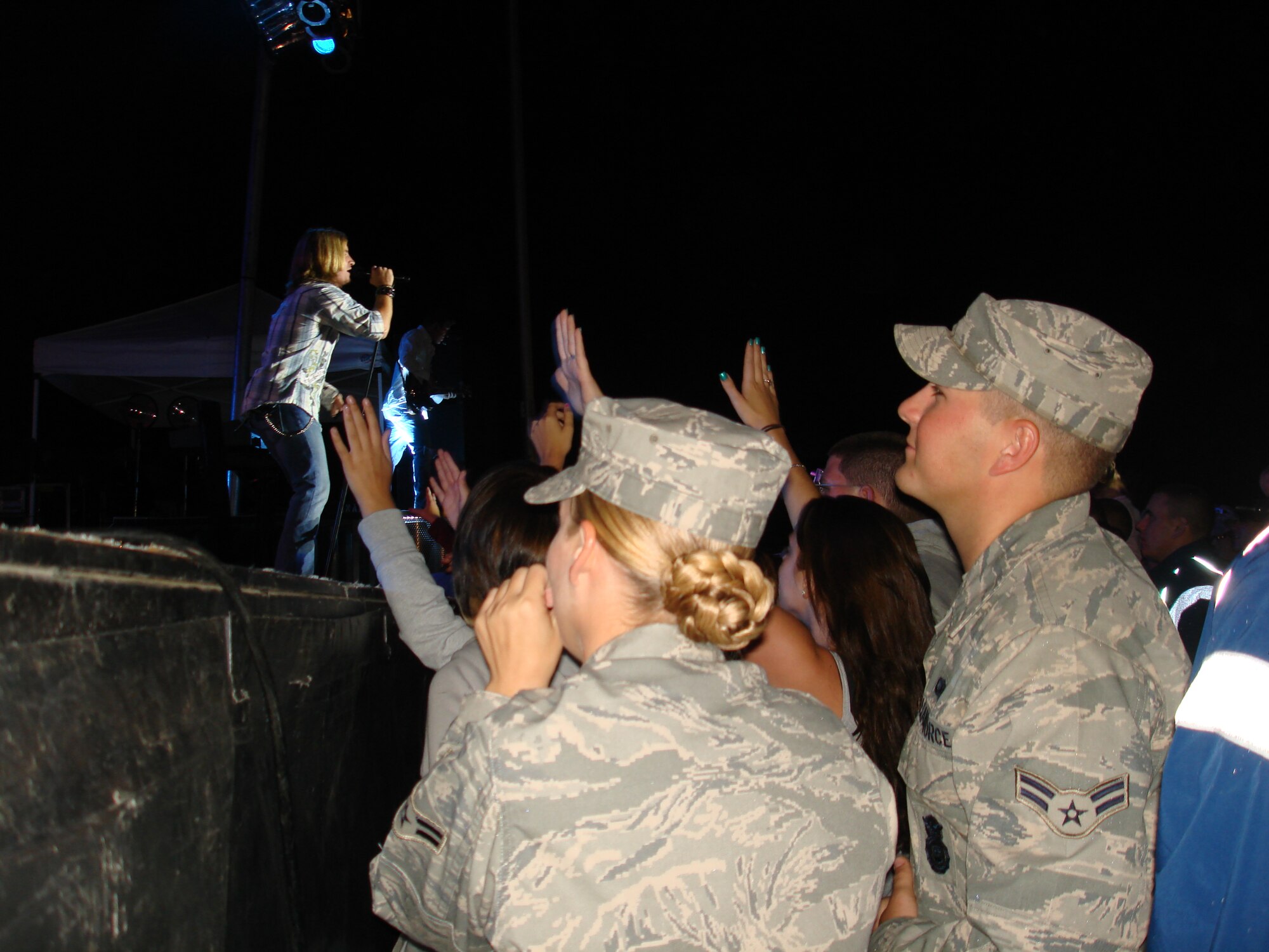 McGuire Airmen watch Lonestar lead singer Cody Collins sing the hit song, “I’m already there” during a free concert held at Fort Dix Sept. 11. The country band held the concert for the McGuire, Fort Dix, and Lakehurst community to pay tribute to those who lost their lives Sept. 11, 2001. (U.S. Air Force photo/Staff Sgt. Frank Lalic)