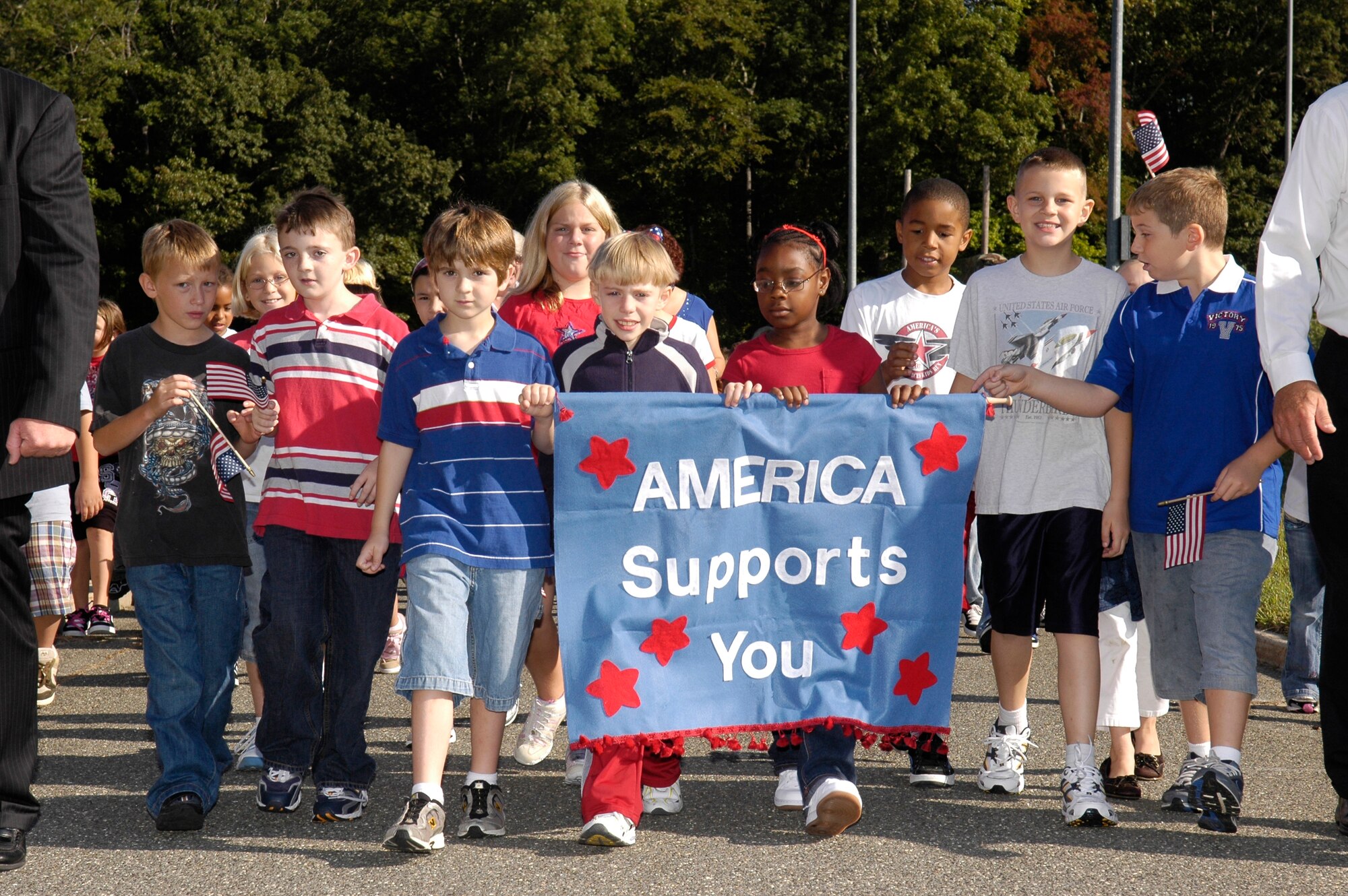 Students from North Hanover Township Schools participate in the third annual America Supports You Freedom Walk Sept. 11. The half-mile walk began at Columbia School and Upper Elementary School at McGuire and proceeded throughout the school’s campus. The participants walked to pay tribute to those who lost their lives Sept. 11, 2001, and to thank past and present veterans for their service. (U.S. Air Force photo/Carlos Cintron) 