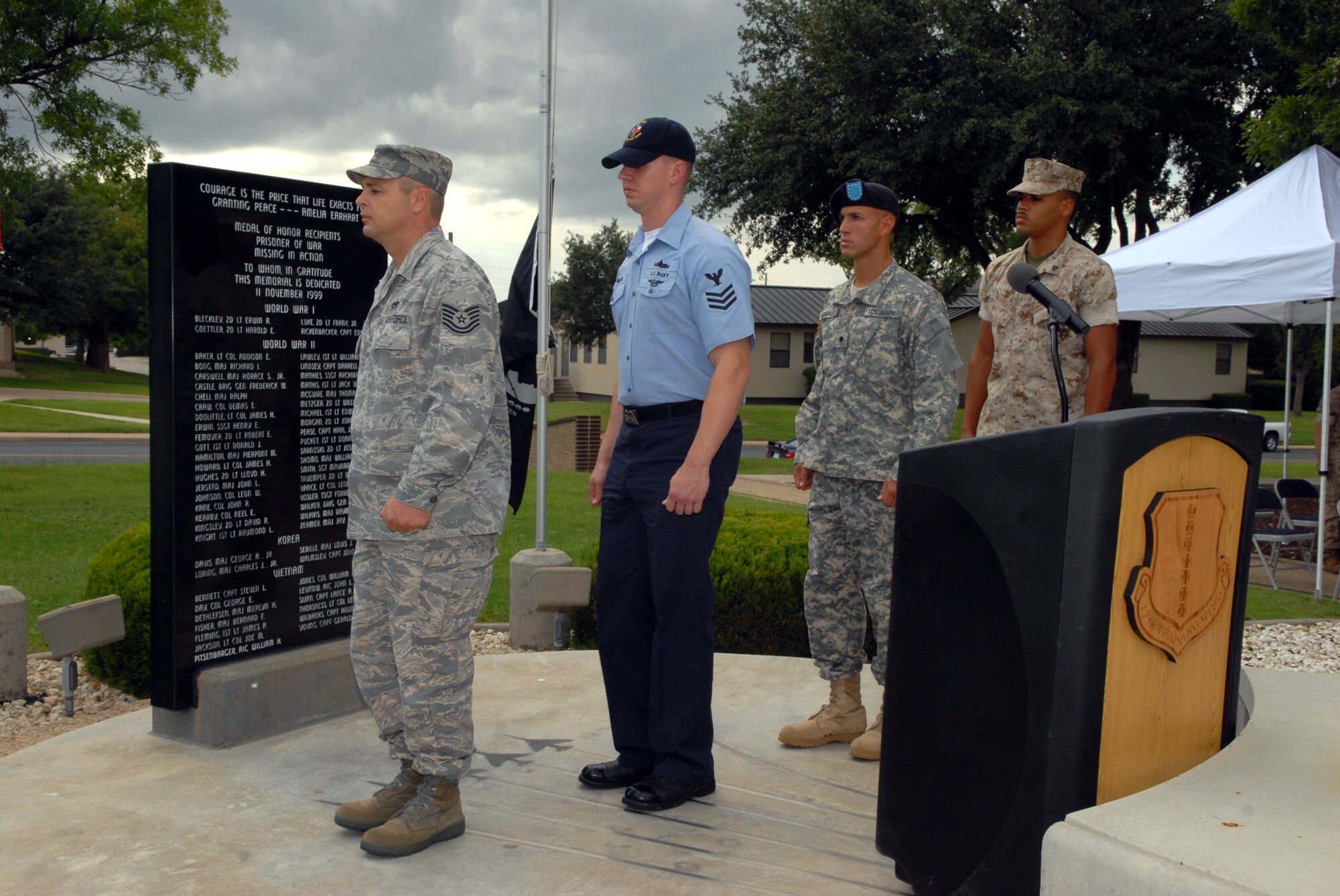 From left to right: Technical Sergeant Jeffrey Purtell, Navy Petty Officer 1st Class David Norman, Army Pfc. Marc Bruce and Marine Corps Corp. Paul Charles stand first watch at 2008 Prisoner of War / Missing in Action vigil Sept. 11. The vigil continued through the night and culminated at the 2008 Air Force Ball. (U.S. Air Force photo by Senior Airman Kasabyan Musal)