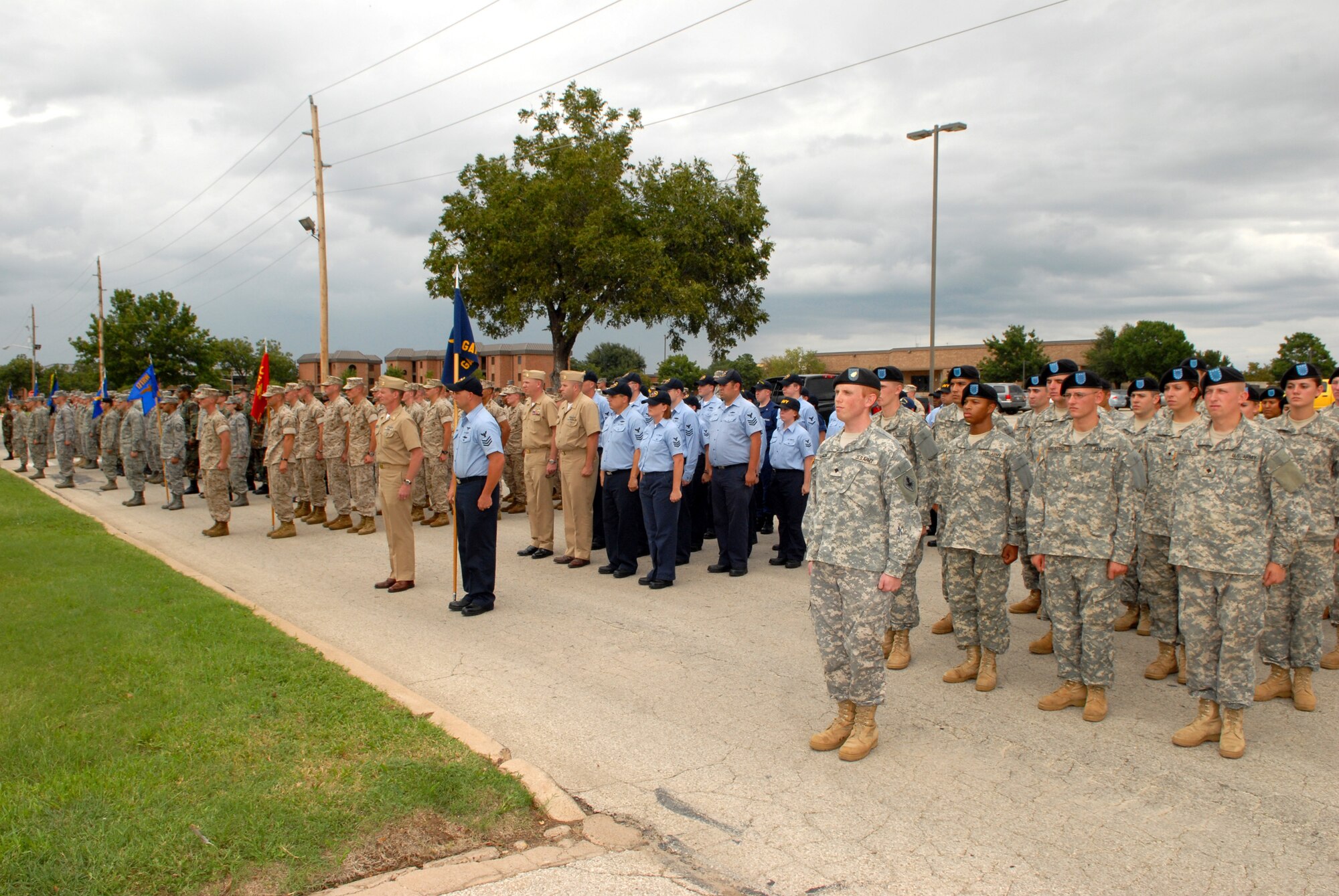 Members of the Air Force, Marine Corps, Navy and Army stand in formation to pay their respects during Goodfellow Air Force Base's 2008 Prisoner of War and Missing in Action Vigil held Sept. 11. The vigil continued through the night and culminated at the 2008 Air Force Ball. (U.S. Air Force photo by Senior Airman Kasabyan Musal)