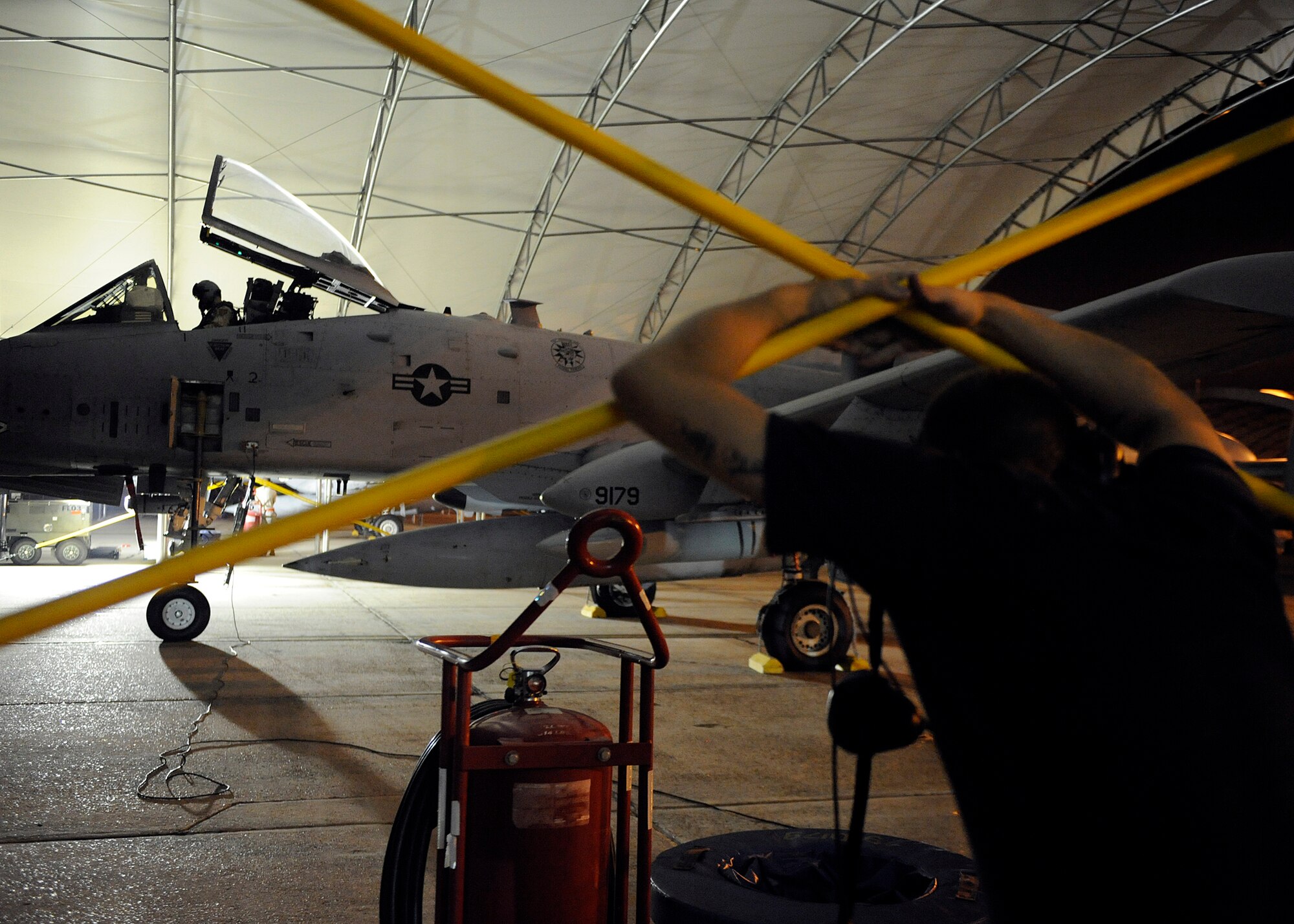MOODY AIR FORCE BASE, Ga. -- An A-10C Thunderbolt II pilot prepares to taxi out of the hangar while a crew chief watches here Sept. 8. The 75th Fighter Squadron is deploying from Moody AFB for the first time. (U.S. Air Force photo by Senior Airman Brittany Barker)