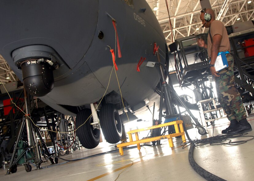 MOODY AIR FORCE BASE, Ga. -- Staff Sgt. Michael Scales, 23rd Equipment Maintenance Squadron aero repair isochronal craftsman, waits for his fellow Airmen to raise the nose landing gear of a HC-130P Hercules here Sept 5. Sergeant Scales is getting ready to perform an operation check for the nose and main landing gear. (U.S. Air Force photo by Airman Joshua Green) 